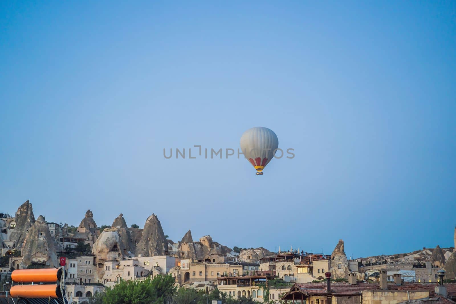 Colorful hot air balloon flying over Cappadocia, Turkey.