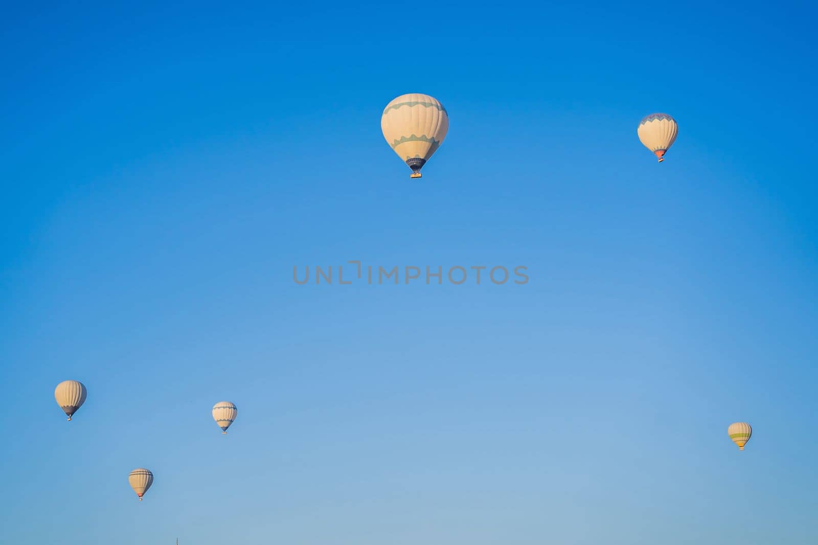 Beautiful hot air balloons over blue sky.