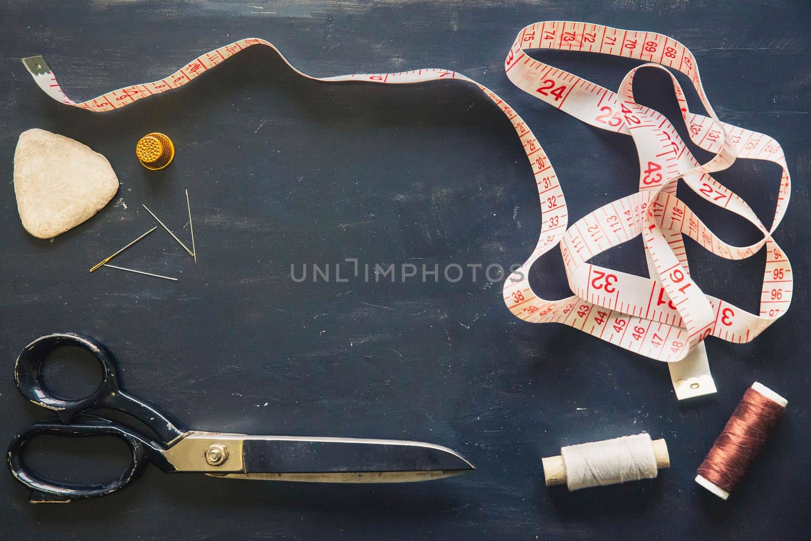 Tailor's set. Scissors, needles, tape measure, thimble and chalk.