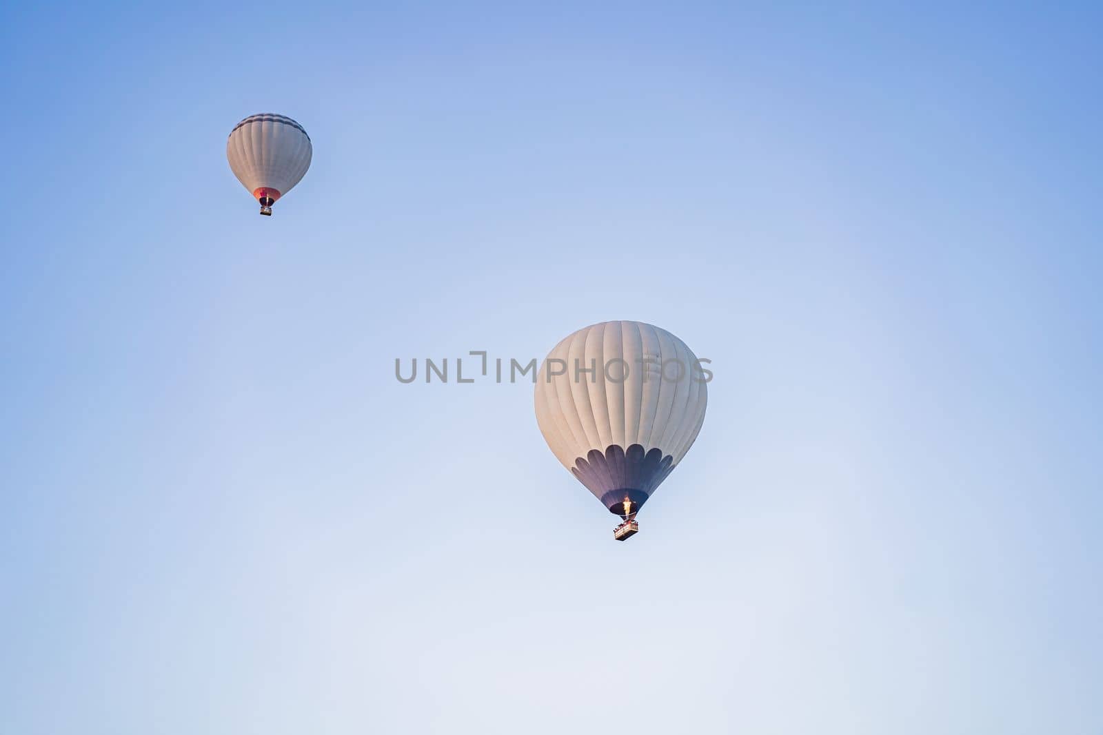 Beautiful hot air balloons over blue sky.