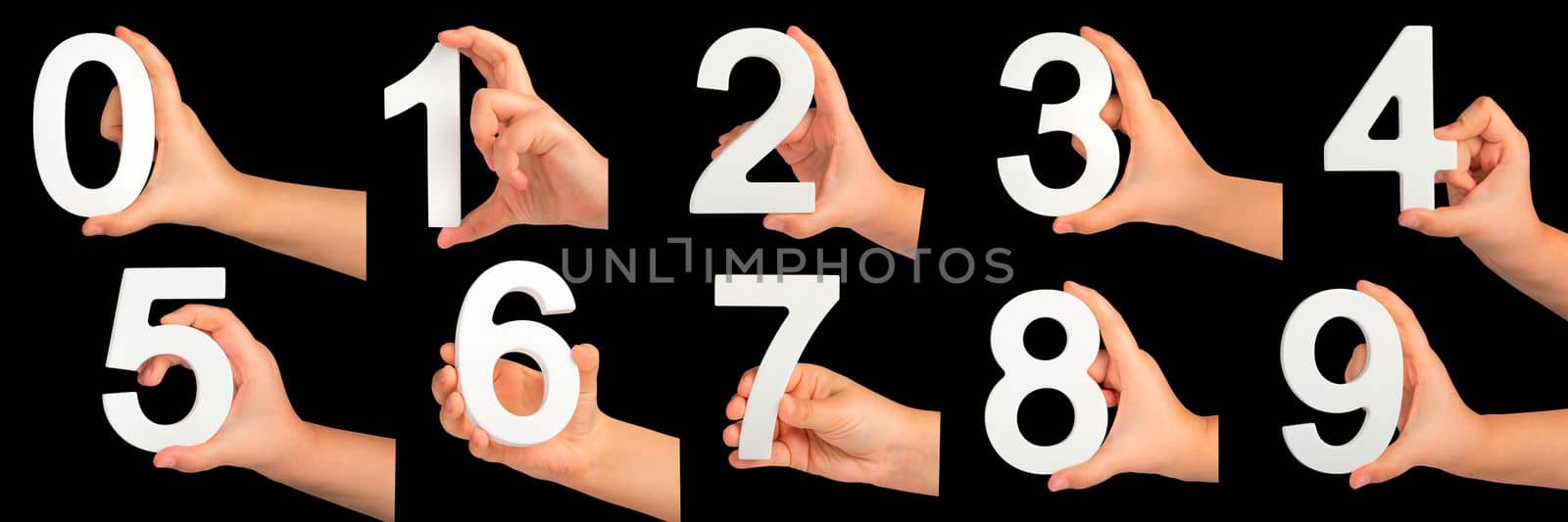 Children's hands hold numbers. A set of white numbers in hands on a black isolated background. Zero, one, two, three, four, five, six, seven, eight, nine. by SERSOL
