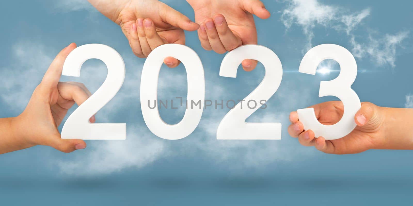 numbers in hands 2 0 2 3. Hands holding numbers folding into the year 2023 kas symbol of the new year. Calendar design or website banner.