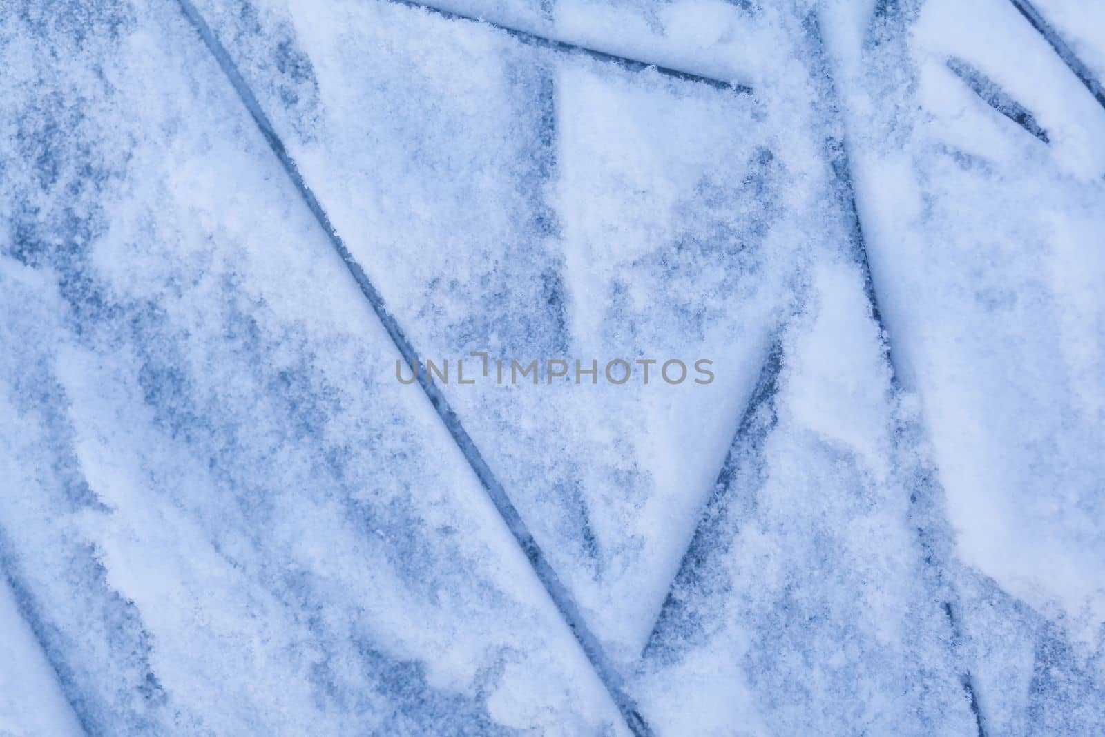 Empty ice rink with skate marks after the session outdoor. by AnatoliiFoto