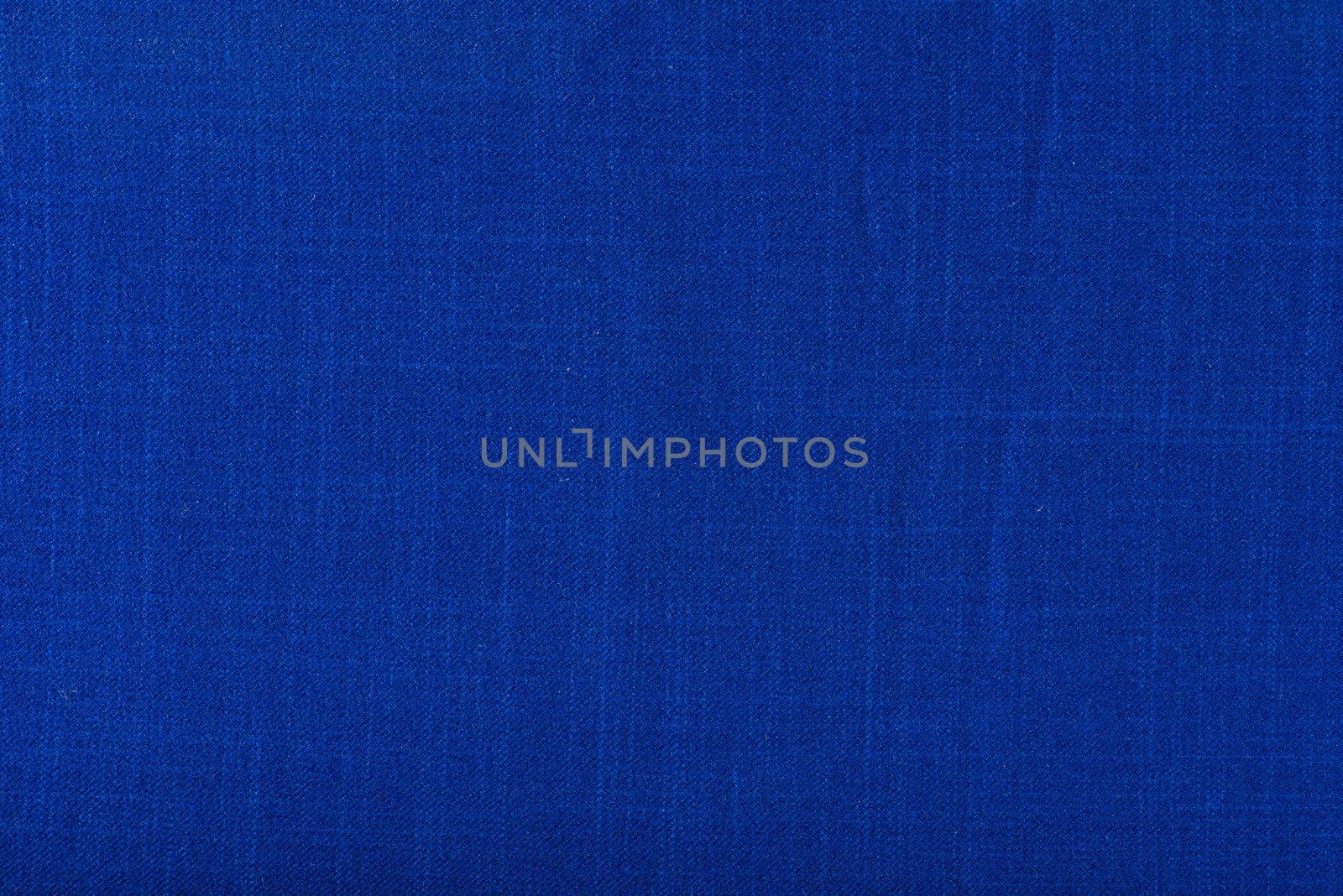 Texture of fabric for furniture upholstery. Wear-resistant fabric for furniture. Texture of blue fabric close up top view