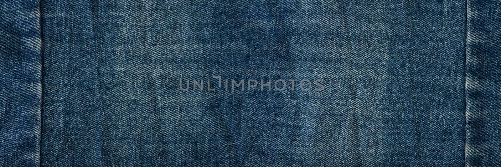 Texture of denim close-up. Jeans seam with place for text by SERSOL