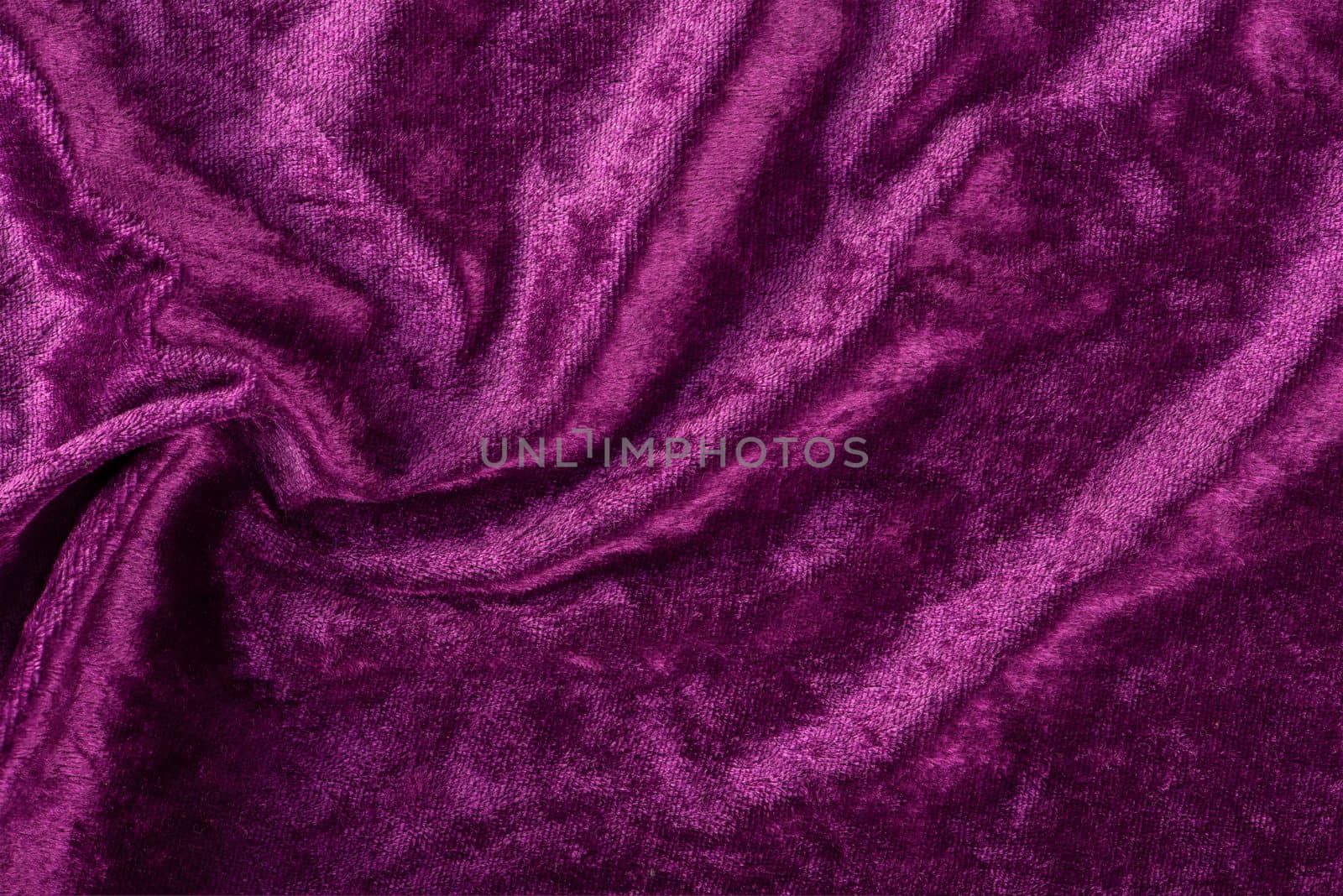 Beautiful purple silk satin background. Soft folds on a shiny fabric. Birthday, Christmas, Valentine's Day. Luxury background with copy space for text, design, web banner