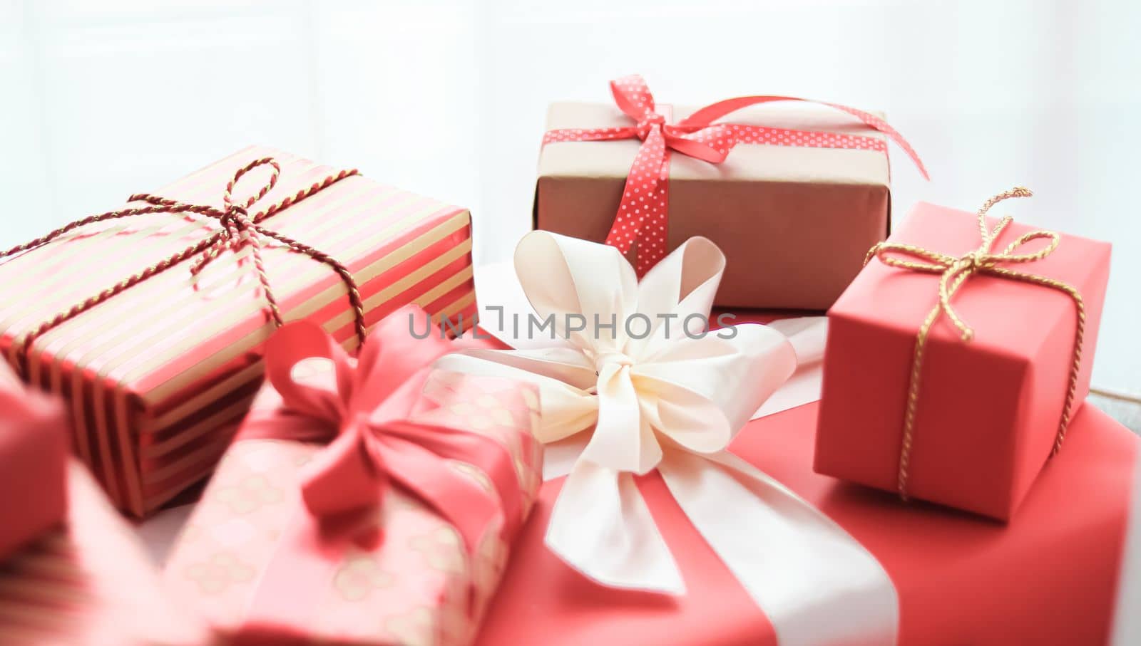 Holiday gifts and wrapped luxury presents, coral gift boxes as surprise present for birthday, Christmas, New Year, Valentines Day, boxing day, wedding and holidays shopping or beauty box delivery concept