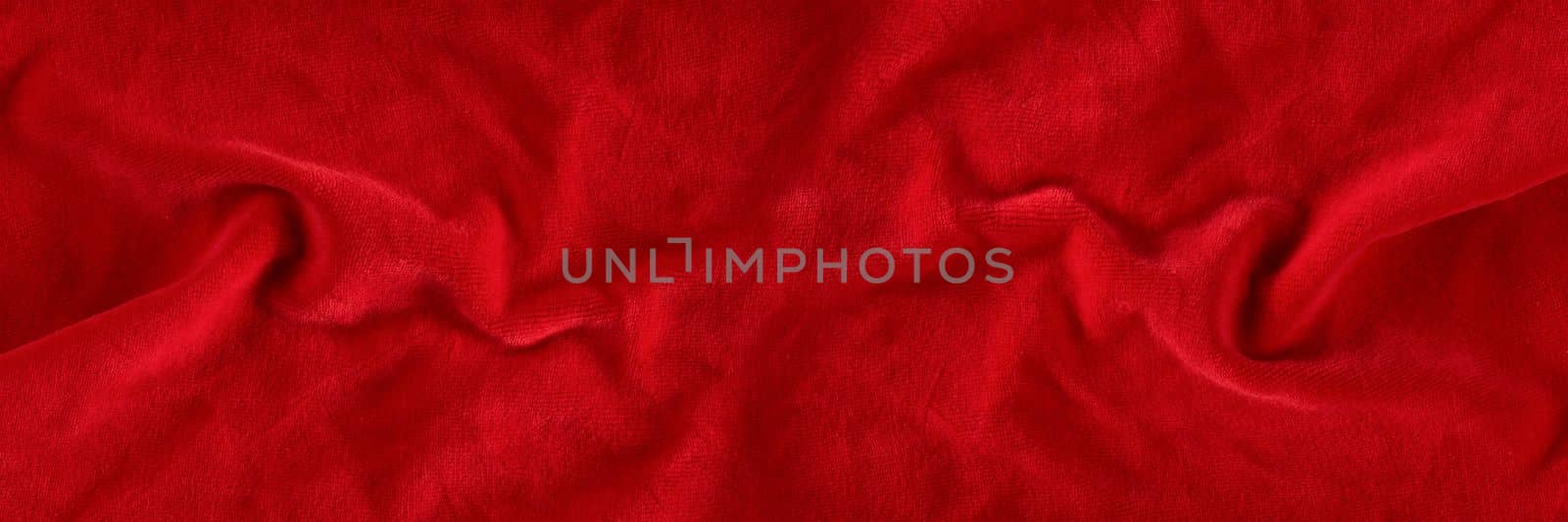 Red velvet texture for postcard or background for design. Red background for Christmas theme or Valentine's day, high quality, large format. Abstract texture of draped red velvet by SERSOL