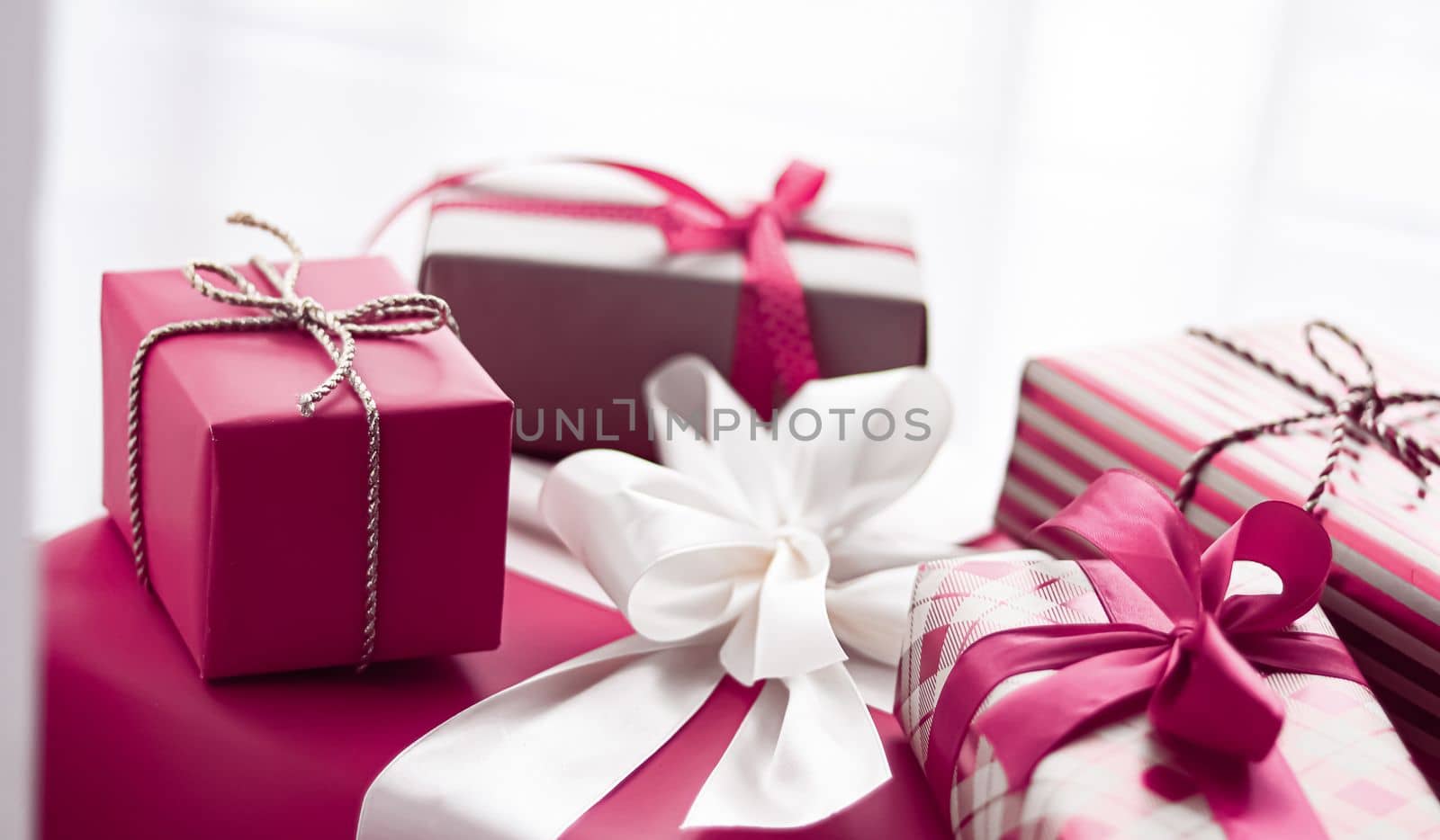 Holiday gifts and wrapped luxury presents, pink gift boxes as surprise present for birthday, Christmas, New Year, Valentines Day, boxing day, wedding and holidays shopping or beauty box delivery concept