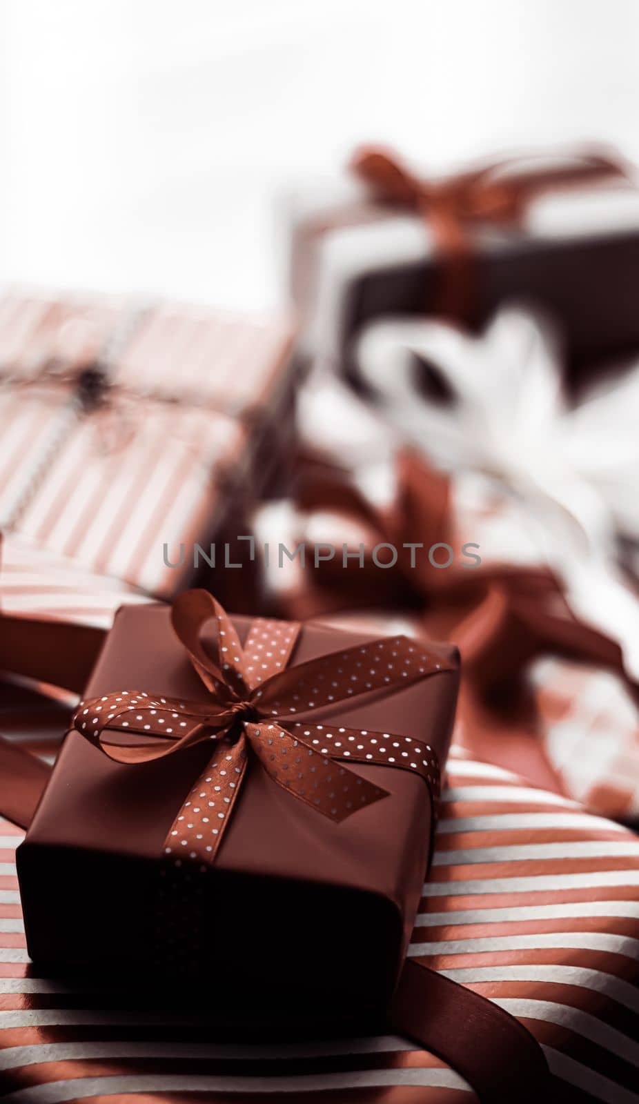 Holiday gifts and wrapped luxury presents, chocolate gift boxes as surprise present for birthday, Christmas, New Year, Valentines Day, boxing day, wedding and holidays shopping or beauty box delivery by Anneleven