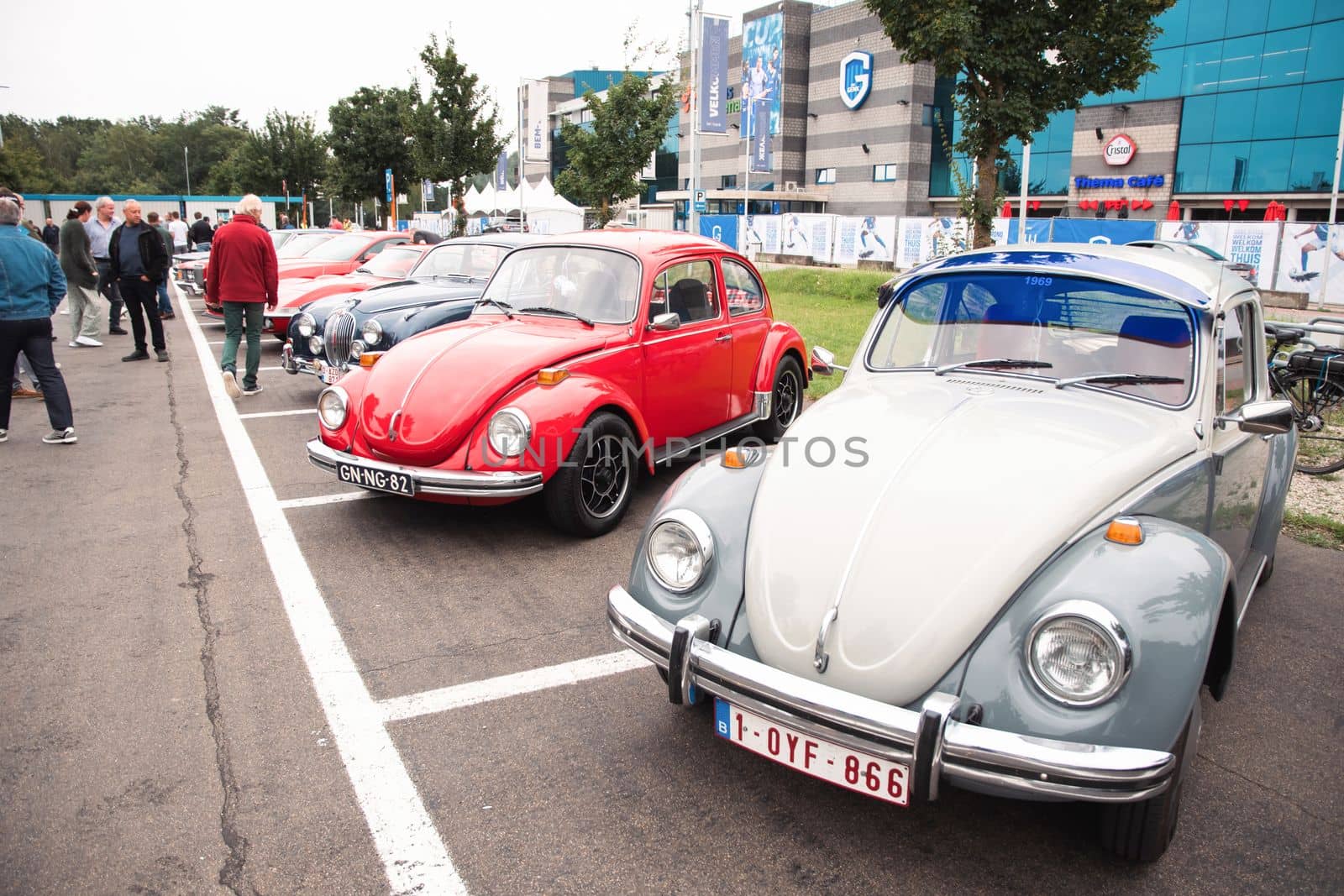 Genk, BELGIUM, August 18, 2021: classic summer meet of oldtimer at The Luminus Arena Genk, red and grey volkswagen beetle, High quality photo