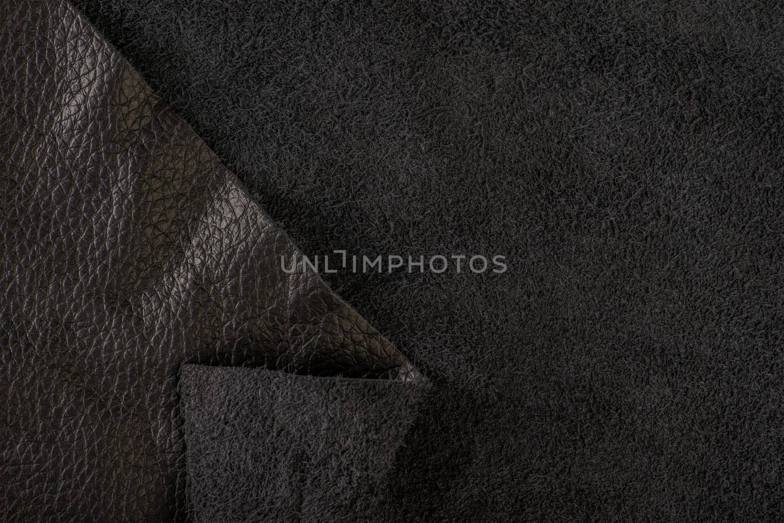 Black suede close-up. Natural black suede texture for design or project. Velvet, leather reverse