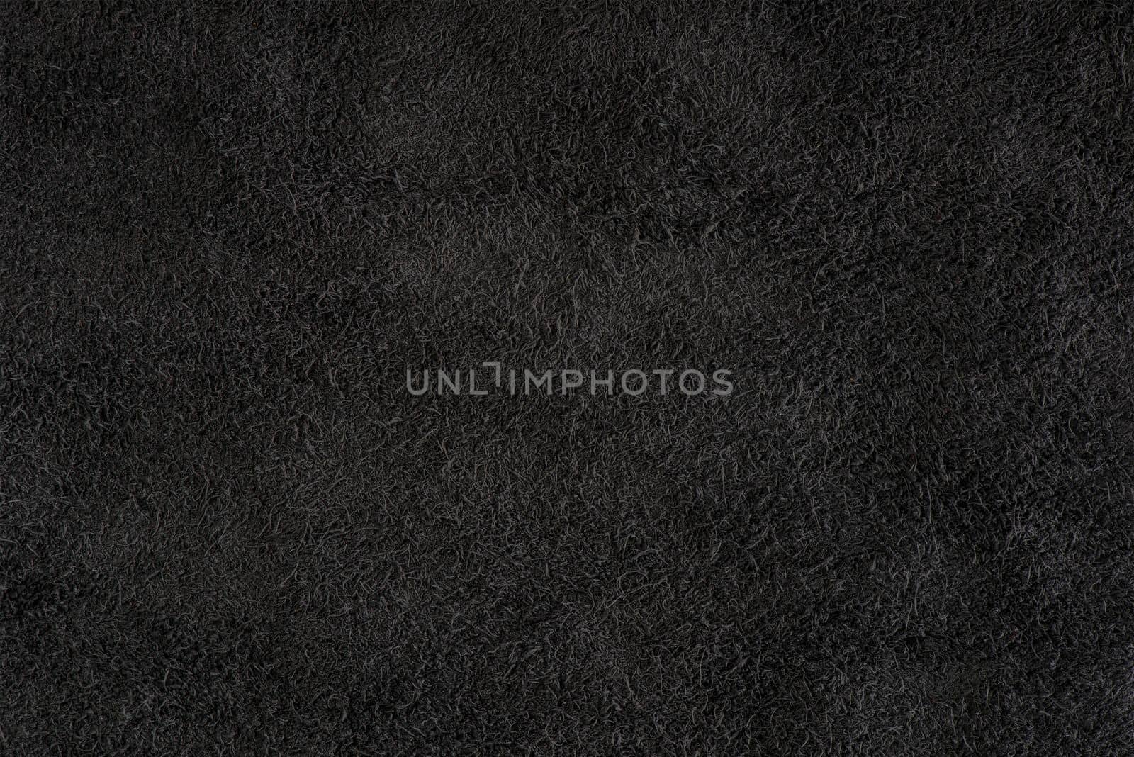 Black suede close-up. Natural black suede texture for design or project. Velvet, leather reverse