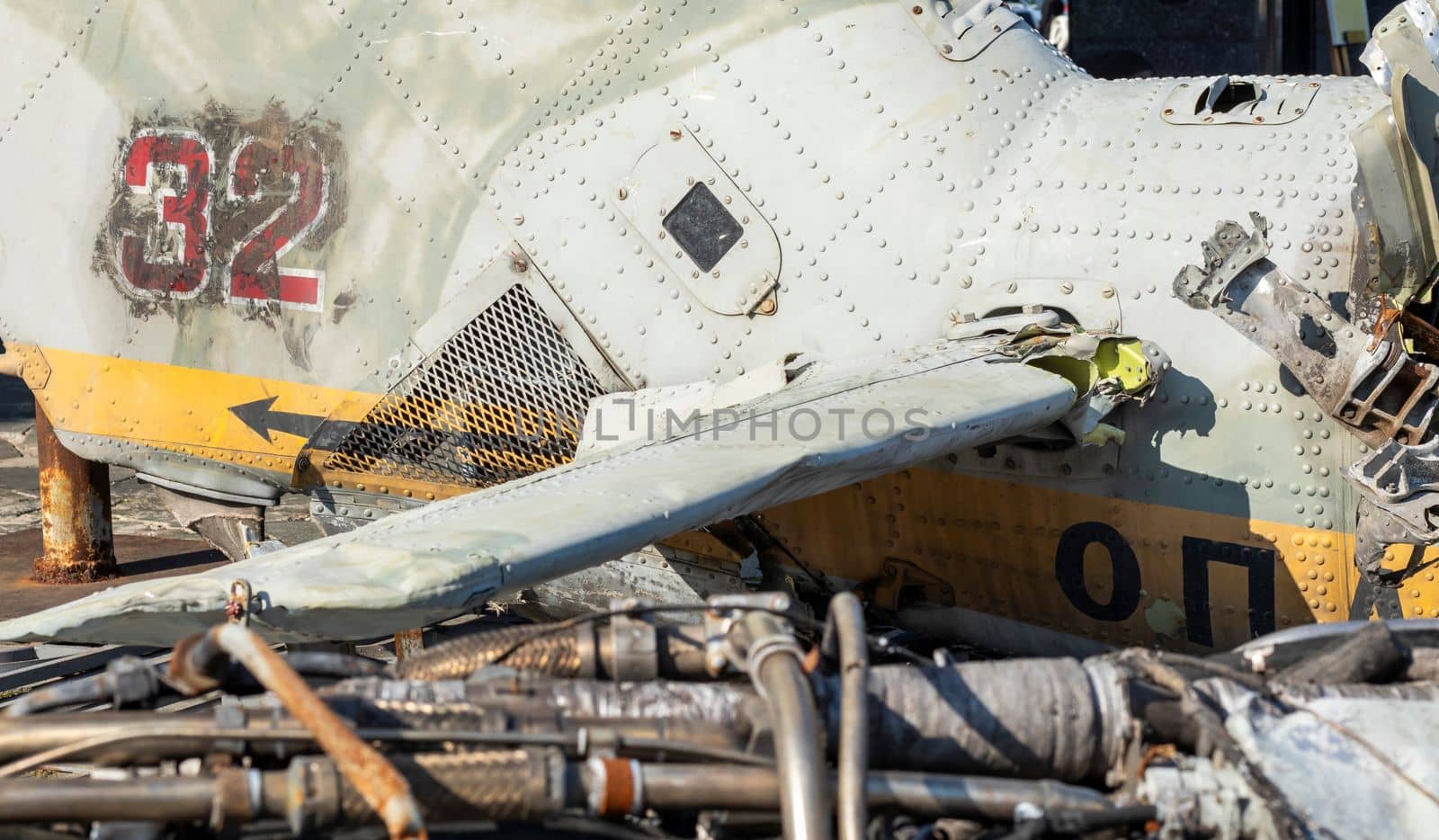 Detail of the Mi-24 helicopter. Remains of a destroyed Russian Air Force combat helicopter Hind Crocodile. Engine rotor, blades, tail, wreckage of a crashed military attack helicopter close-up