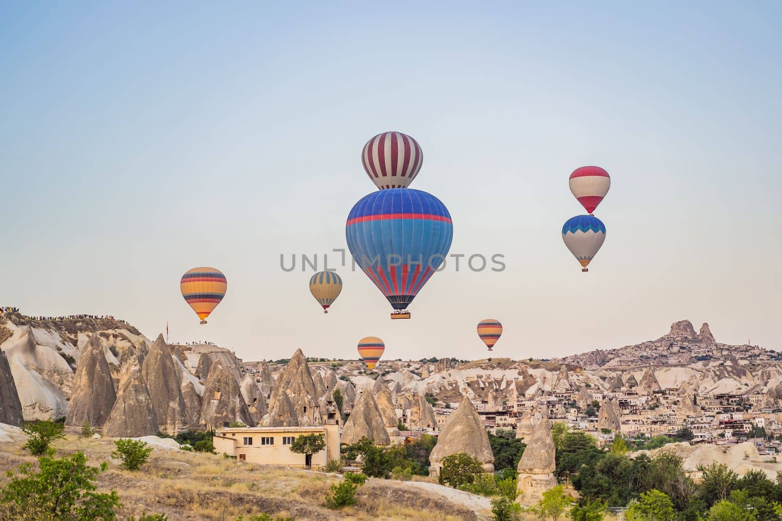 Colorful hot air balloon flying over Cappadocia, Turkey by galitskaya