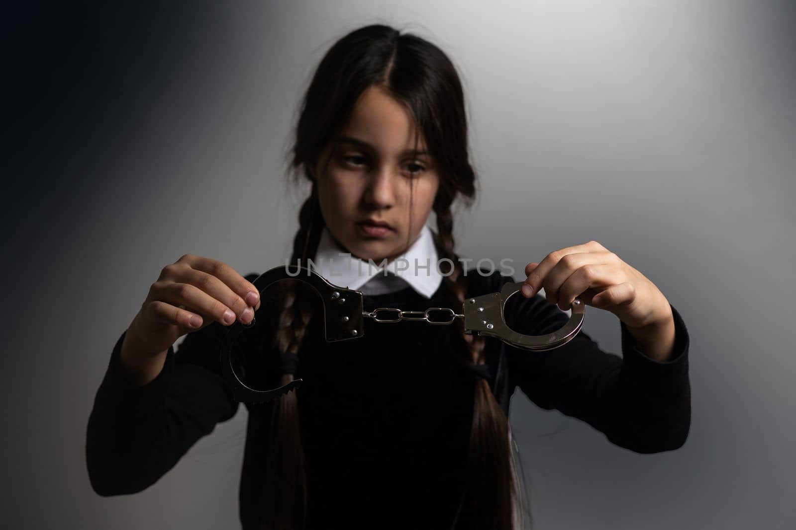 Wednesday . Gothic girl with handcuff.