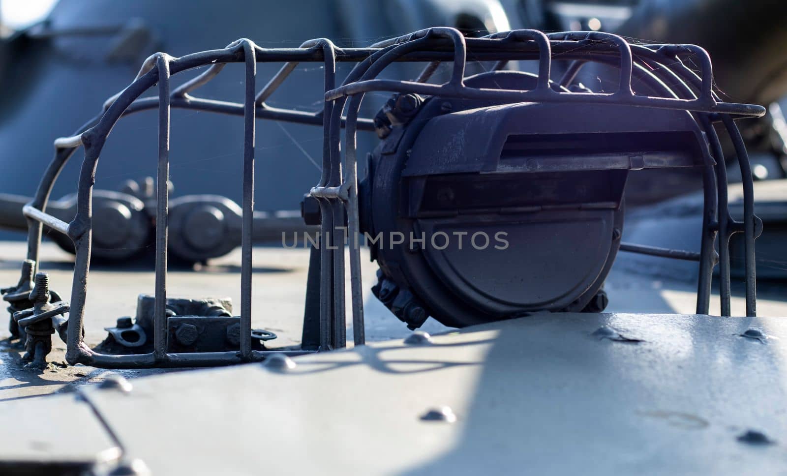 Protection elements of the military light amphibious tank PT-76. Lantern for lighting with protection on a Soviet tank, object 740. Lantern of an infantry fighting vehicle. Tank lights