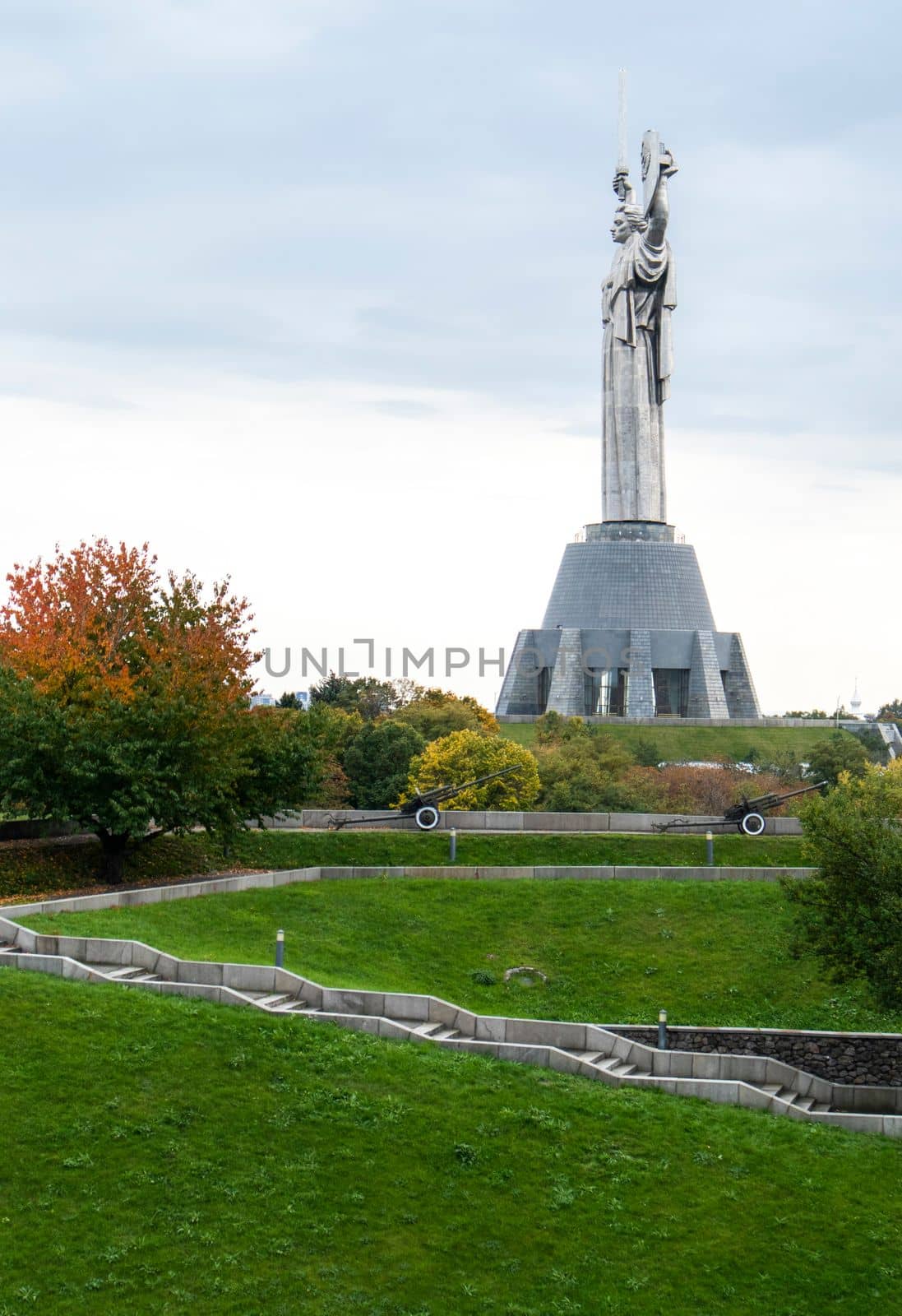Statue of the Motherland against the blue sky. The fifth largest statue in the world and the highest in Ukraine. Located on the territory of the Museum of the History of Ukraine in World War II