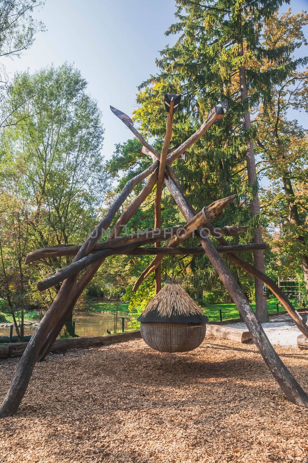 Round children's house suspended from huge Indian spears on the playground of the Ljubljana Zoo