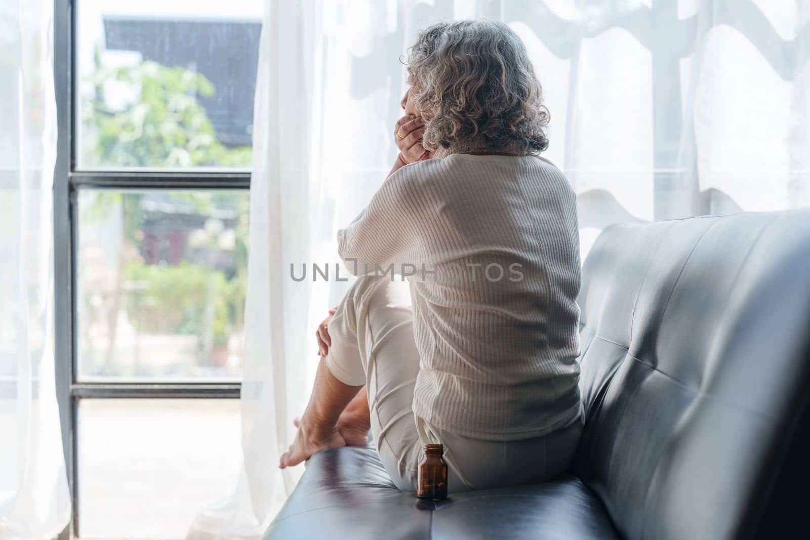 Pensive older woman lonely old senior in is home by itchaznong