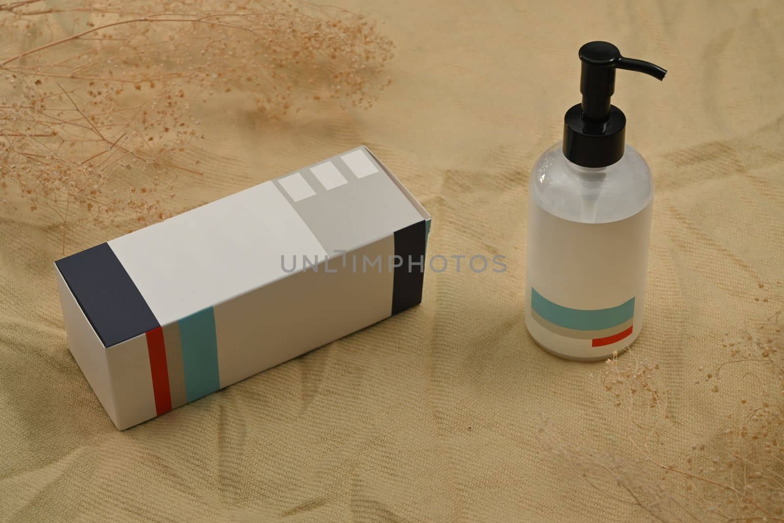 Shampoo or soap plastic bottle dispenser on cotton silk fabric. Natural skincare, beauty product design concept by prathanchorruangsak