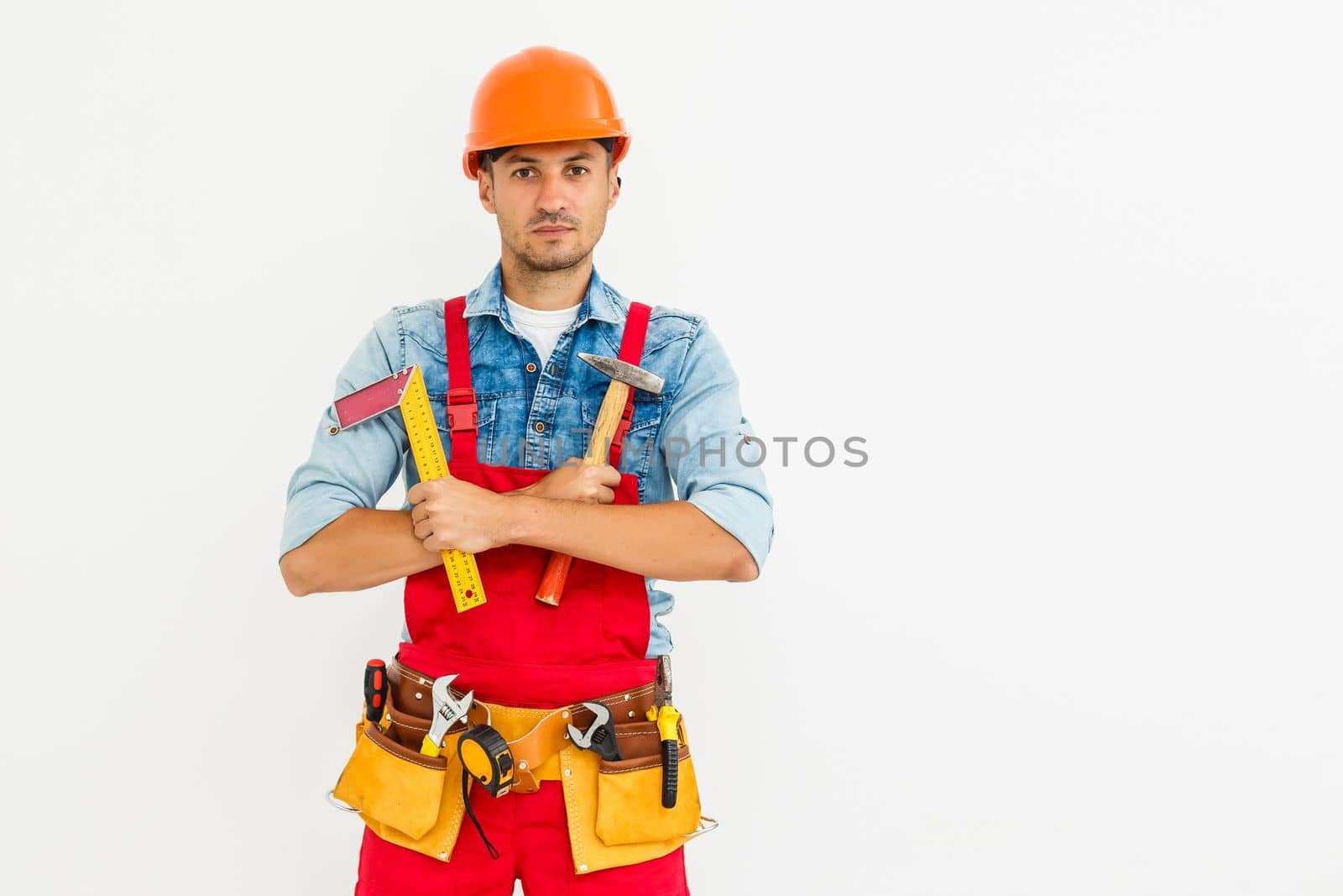 profession, construction and building - happy smiling male worker or builder in helmet over white background