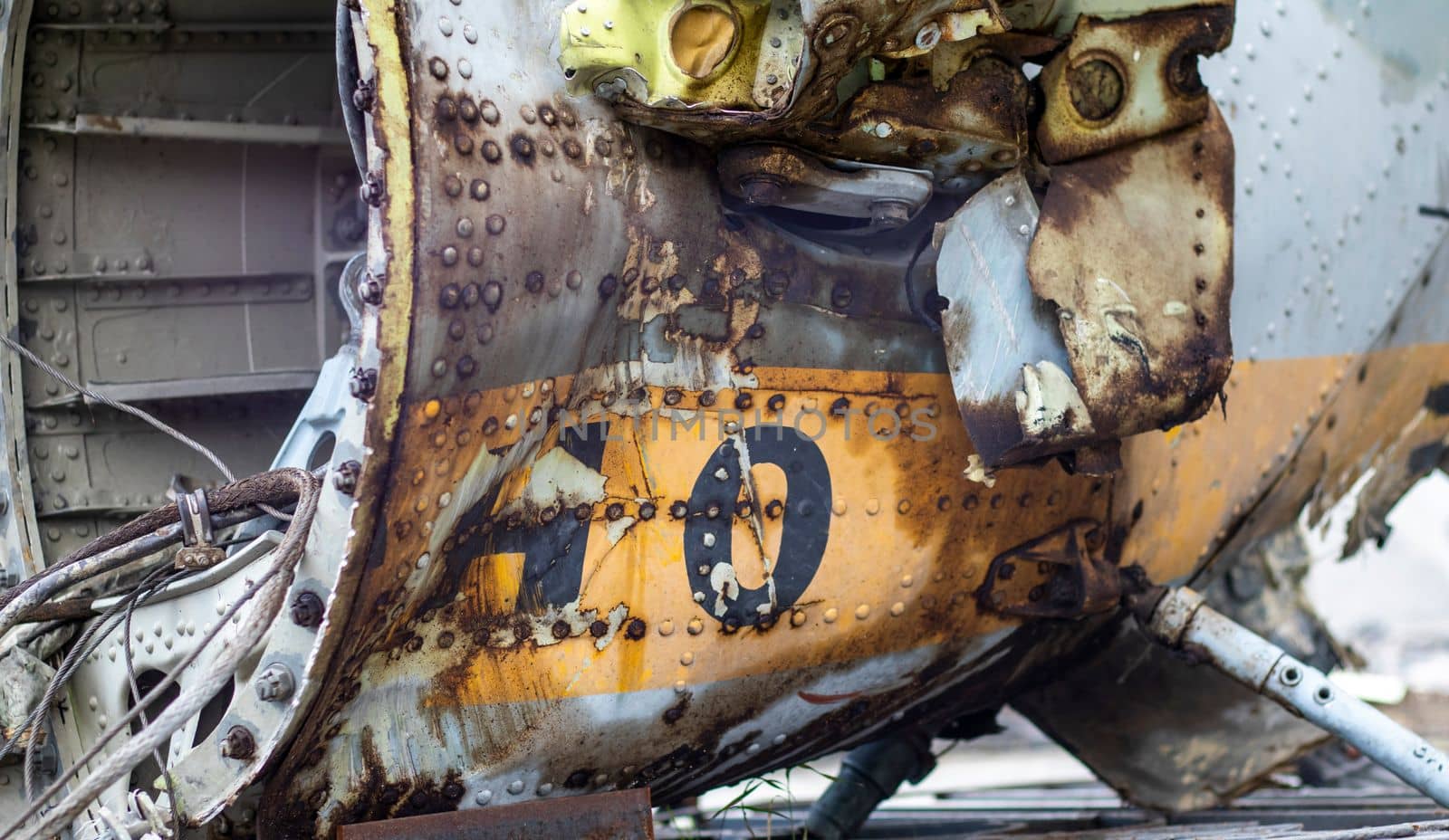 Detail of the Mi-24 helicopter. Remains of a destroyed Russian Air Force combat helicopter Hind Crocodile. Engine rotor, blades, tail, wreckage of a crashed military attack helicopter close-up