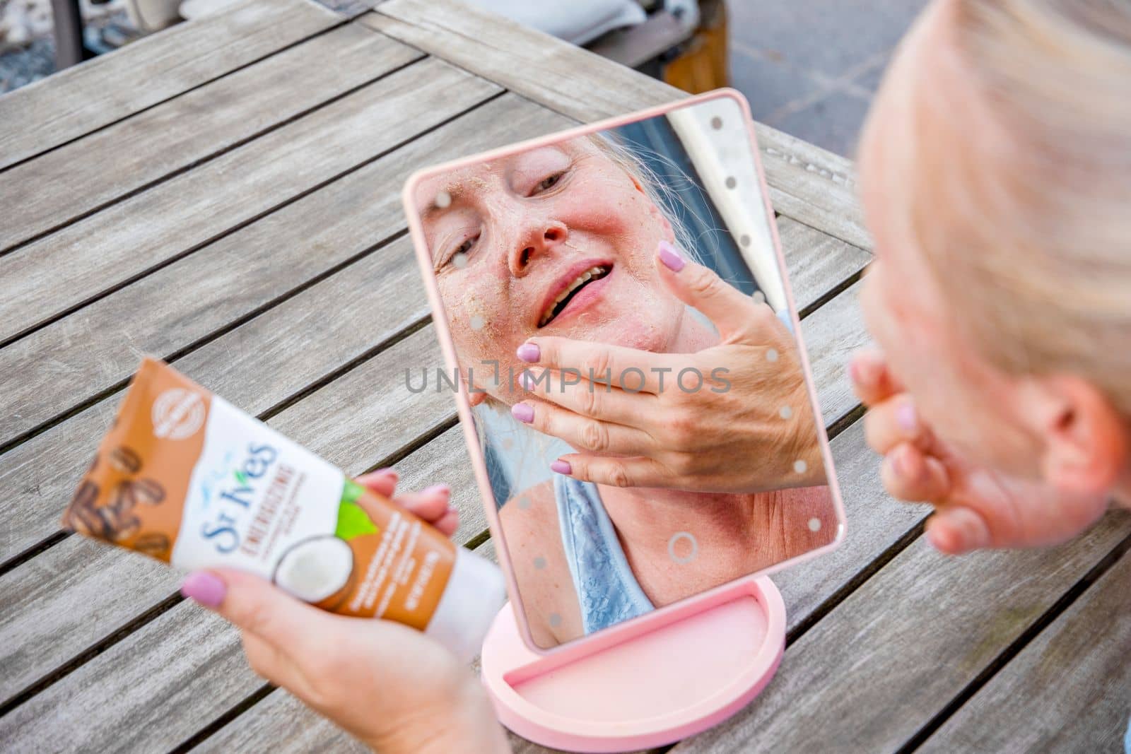 ST. Ives Fresh Energizing Coconut and Coffee Scrub in Tube, reflections in the mirror, abstract, As,Belgium, August 13,2022, High quality photo