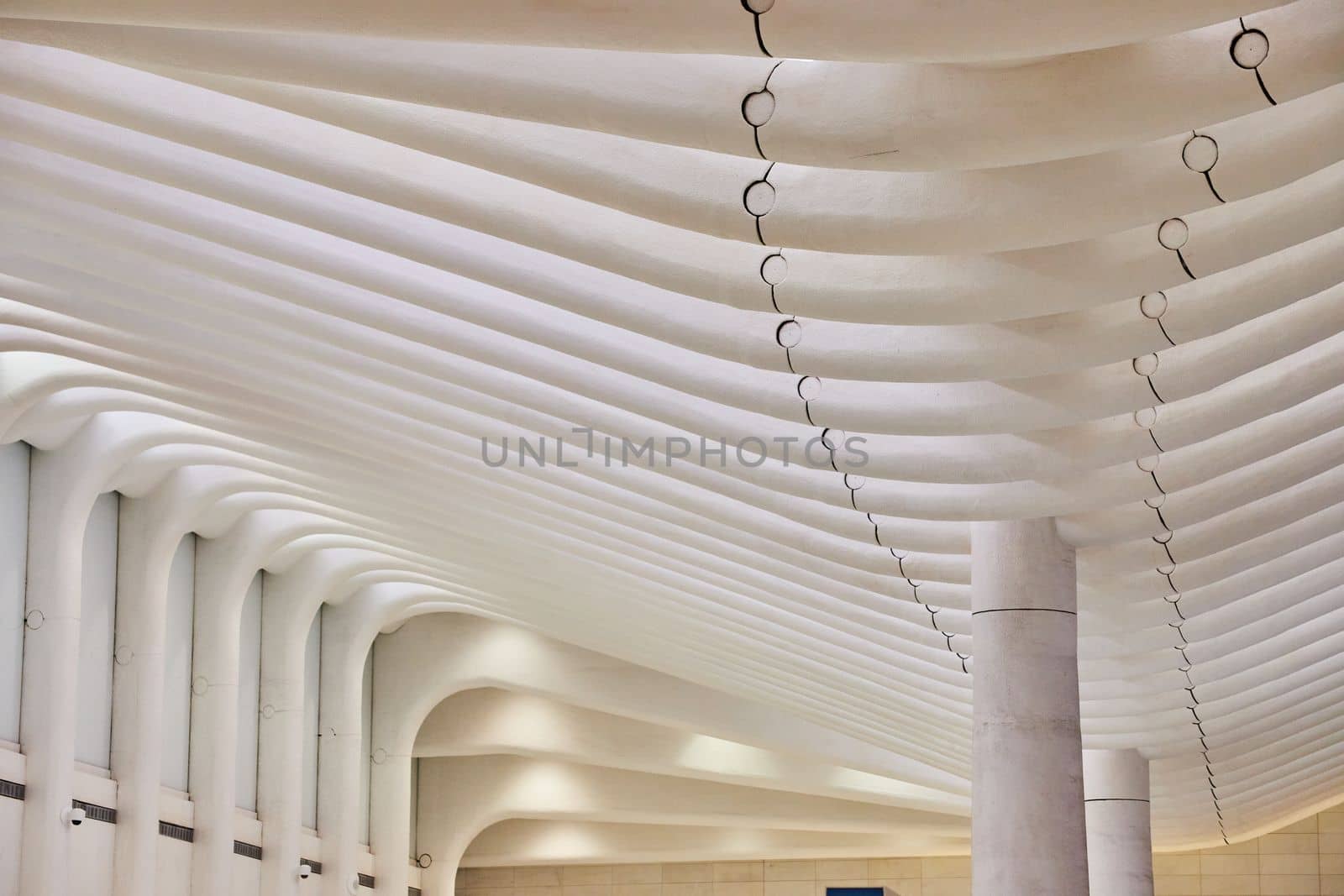 Clean white interior architecture ceiling with pillars and white ribs by njproductions