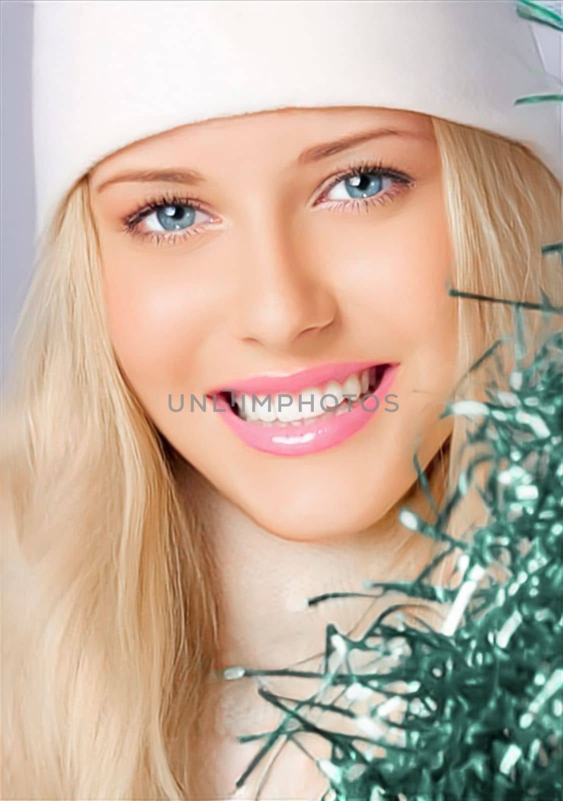 Happy holidays, Merry Christmas, and a woman wearing a white benny hat, beauty, and fashion. Portrait of a lovely blonde woman grinning and enjoying the Christmas, New Year, and winter vacations by Anneleven