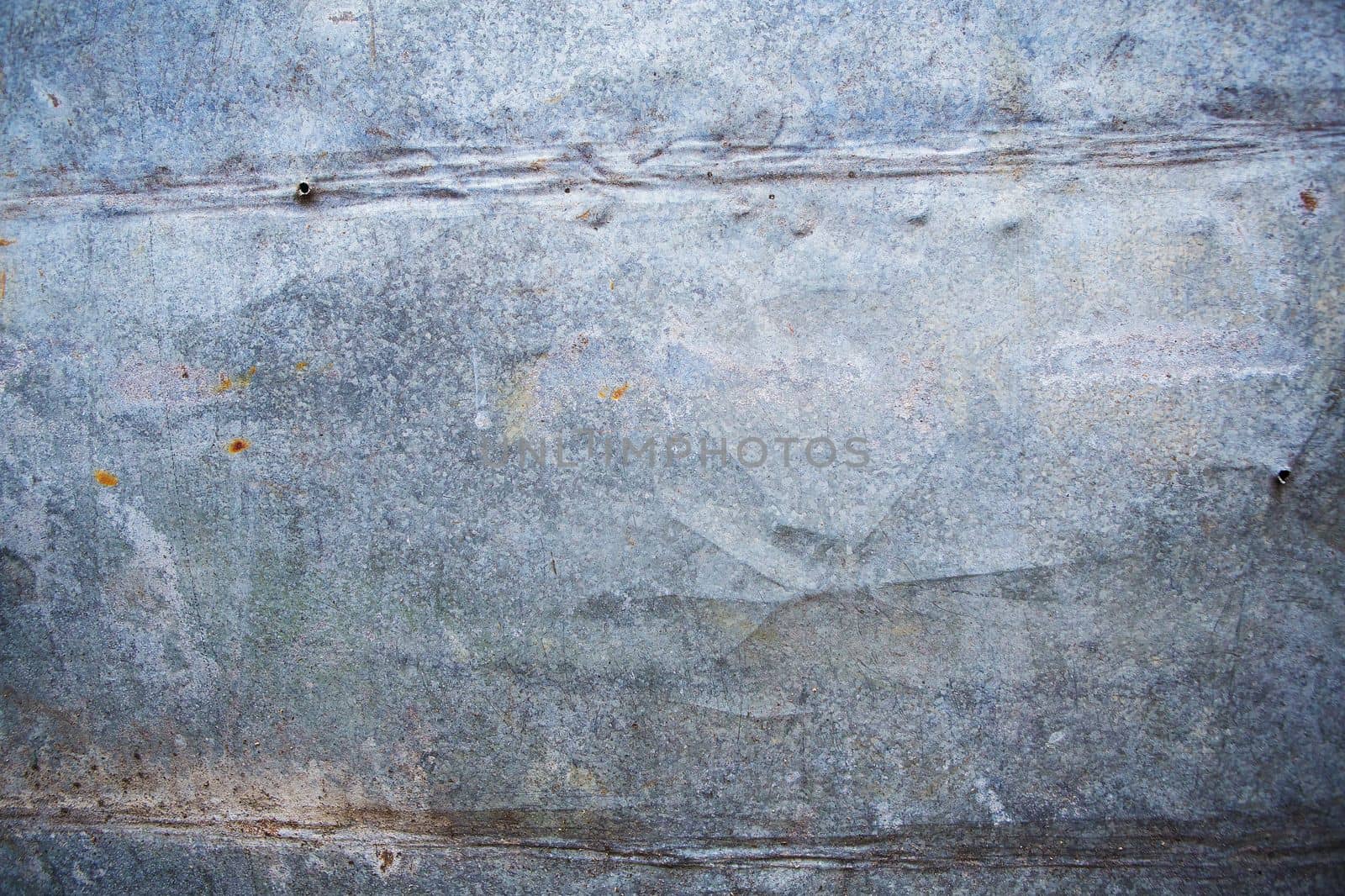 Metal background with traces of old age, traces of iron nails.