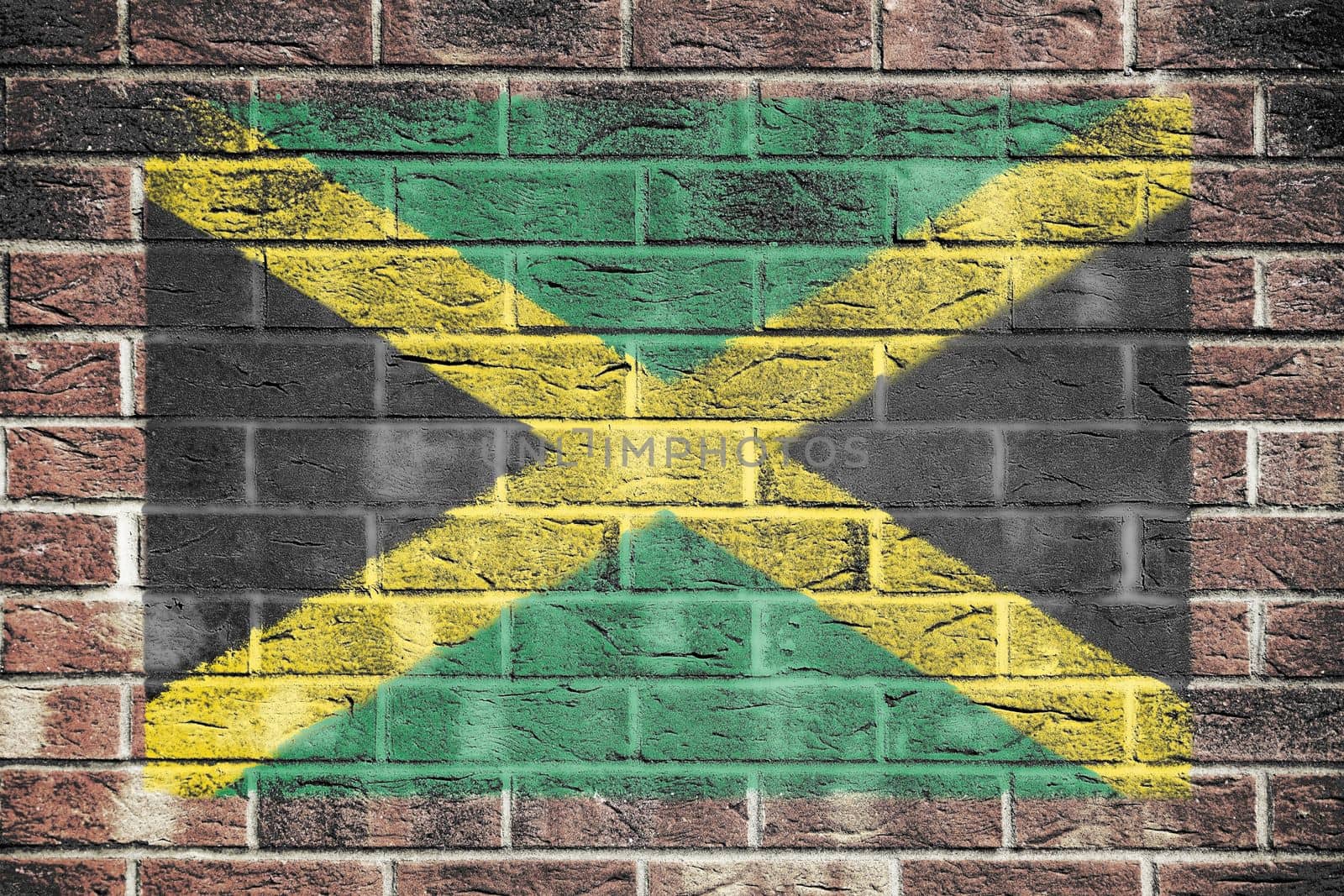 Jamaica flag painted on brick wall background by VivacityImages