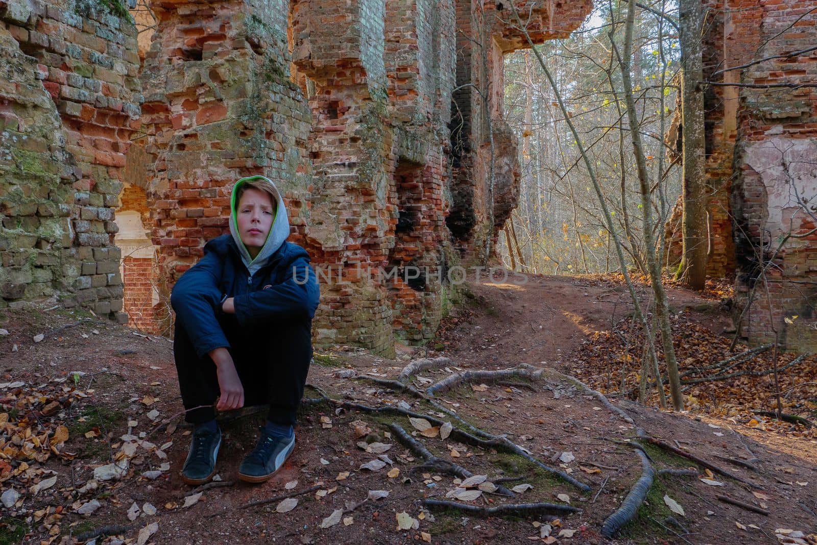 A teenager sits in an old abandoned house. by gelog67