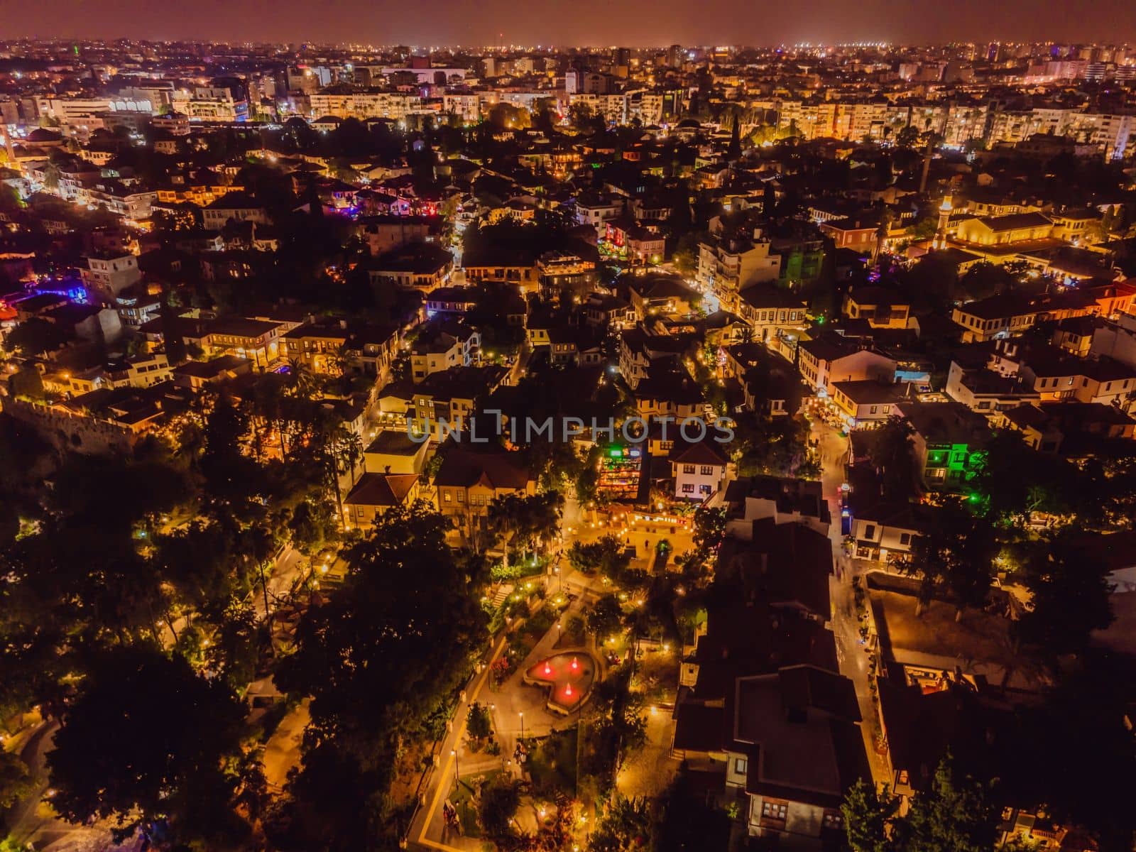 Night top aerial view of the old town Kaleici and old harbor in Antalya, Turkey. Turkey is a popular tourist destination.