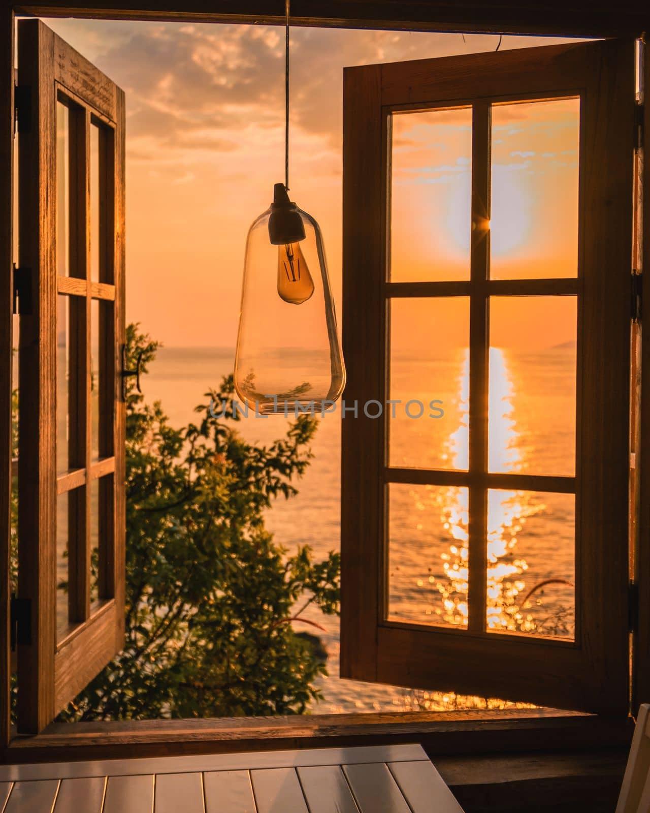 Turkey, Fethiye sunset by the beach through a window with a view at the horizon of Turkey during vacation Fethiye