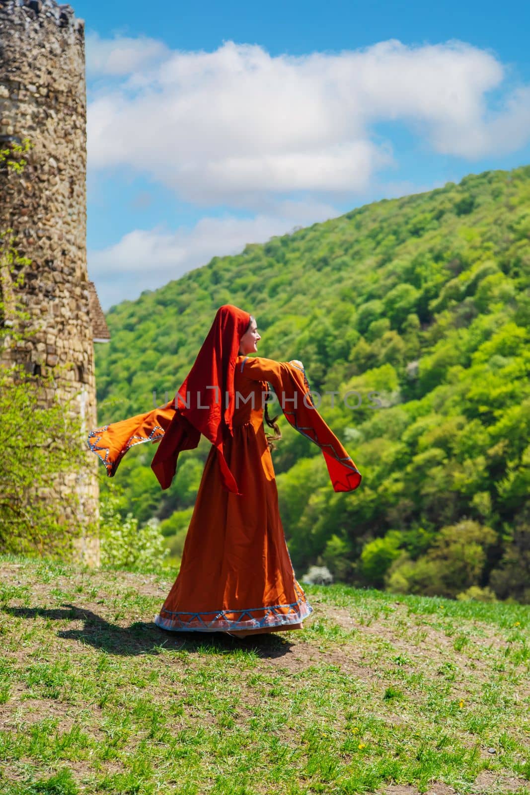 Georgian girl in national costume dances Georgian national dances. selective focus. by mila1784