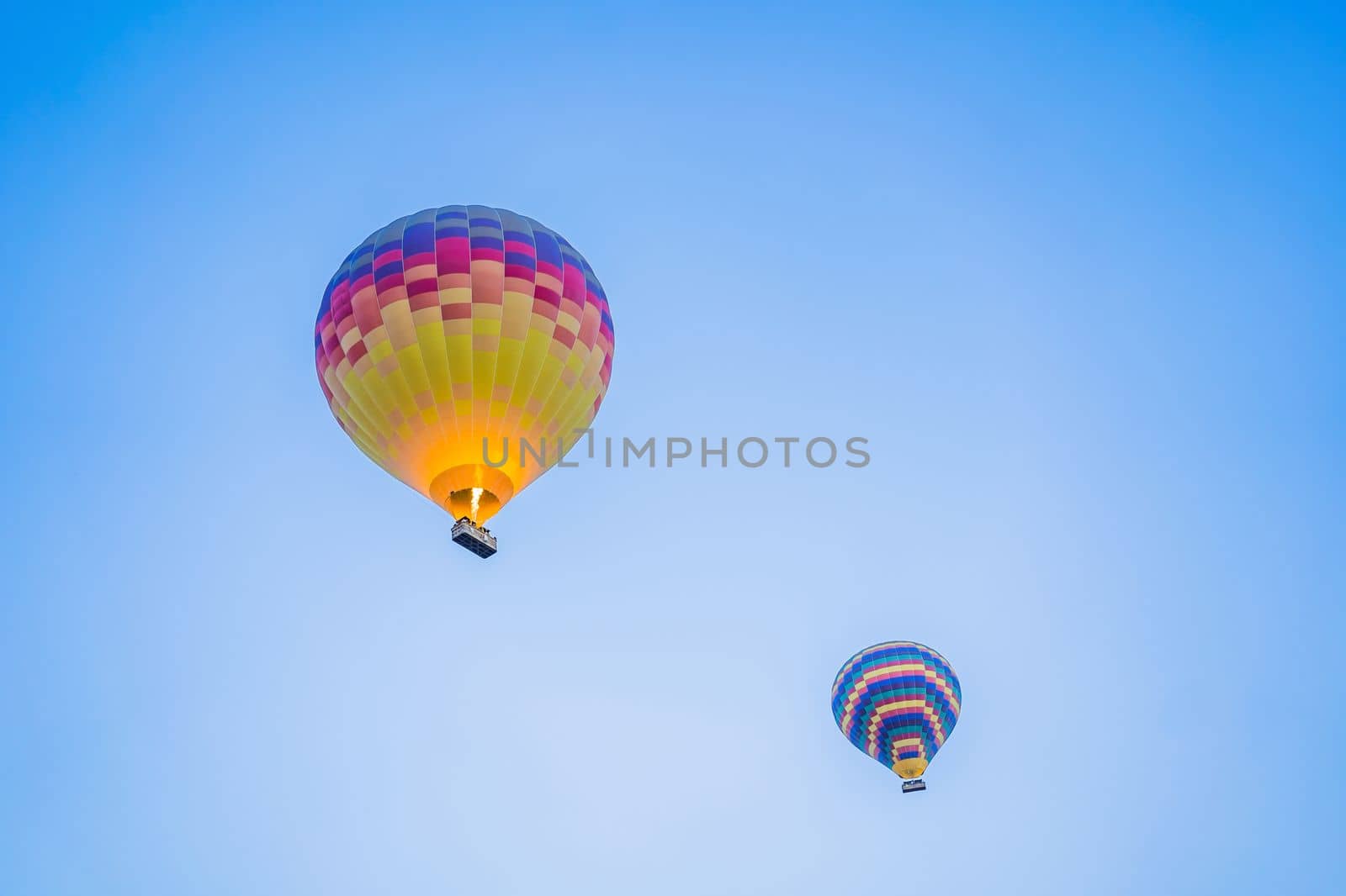 Beautiful hot air balloons over blue sky.