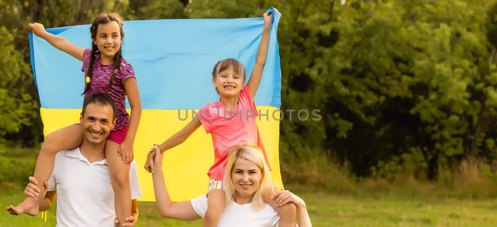 Ukraine's Independence Flag Day. Constitution day. family with the flag of ukraine in field. 24 August. Patriotic holiday