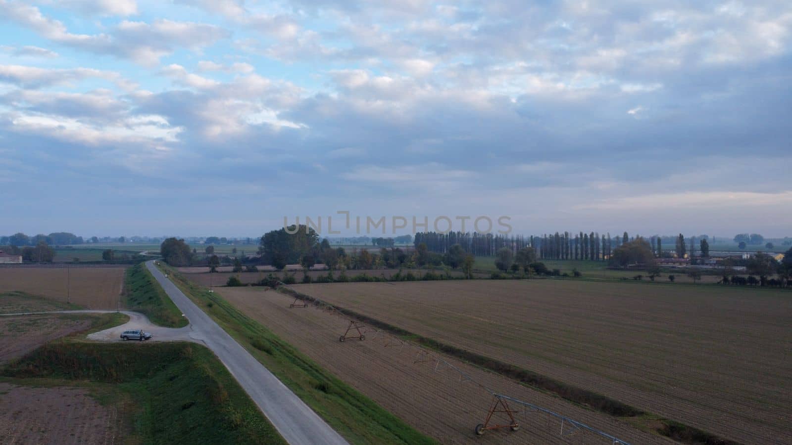 Stagno Lombardo, Italy - November 2022 drone view of rural area near river Po at dusk