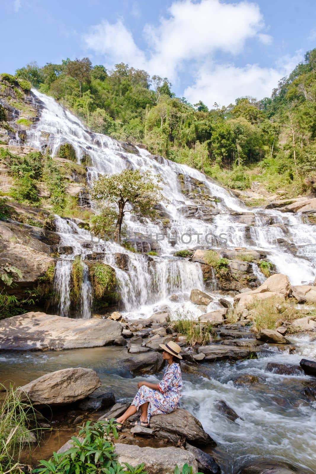 Thai Asian women visit Mae Ya Waterfall Doi Inthanon national park Thailand Chiang Mai. 