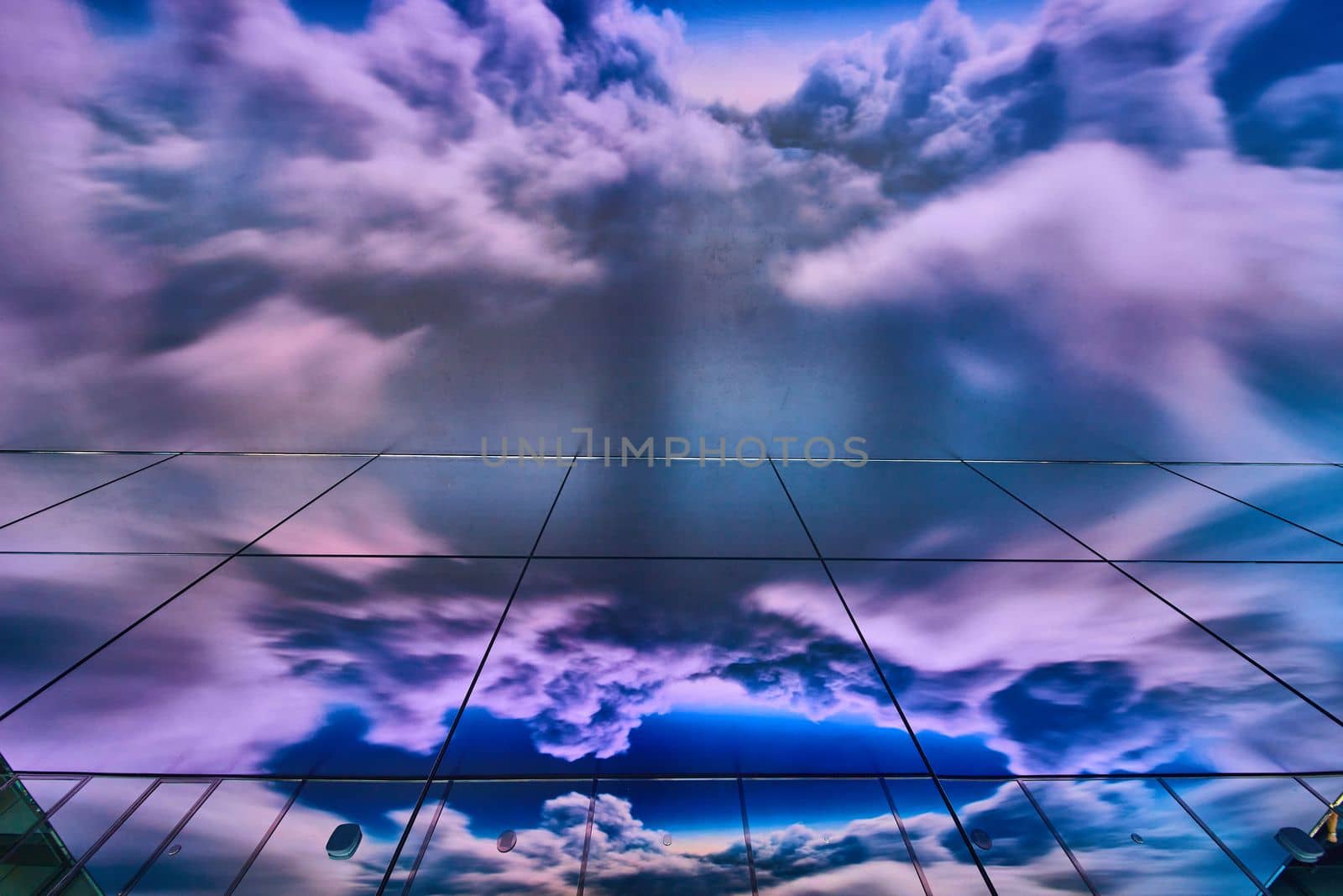 Image of Mirror wall and augmented reality of storm clouds on glass