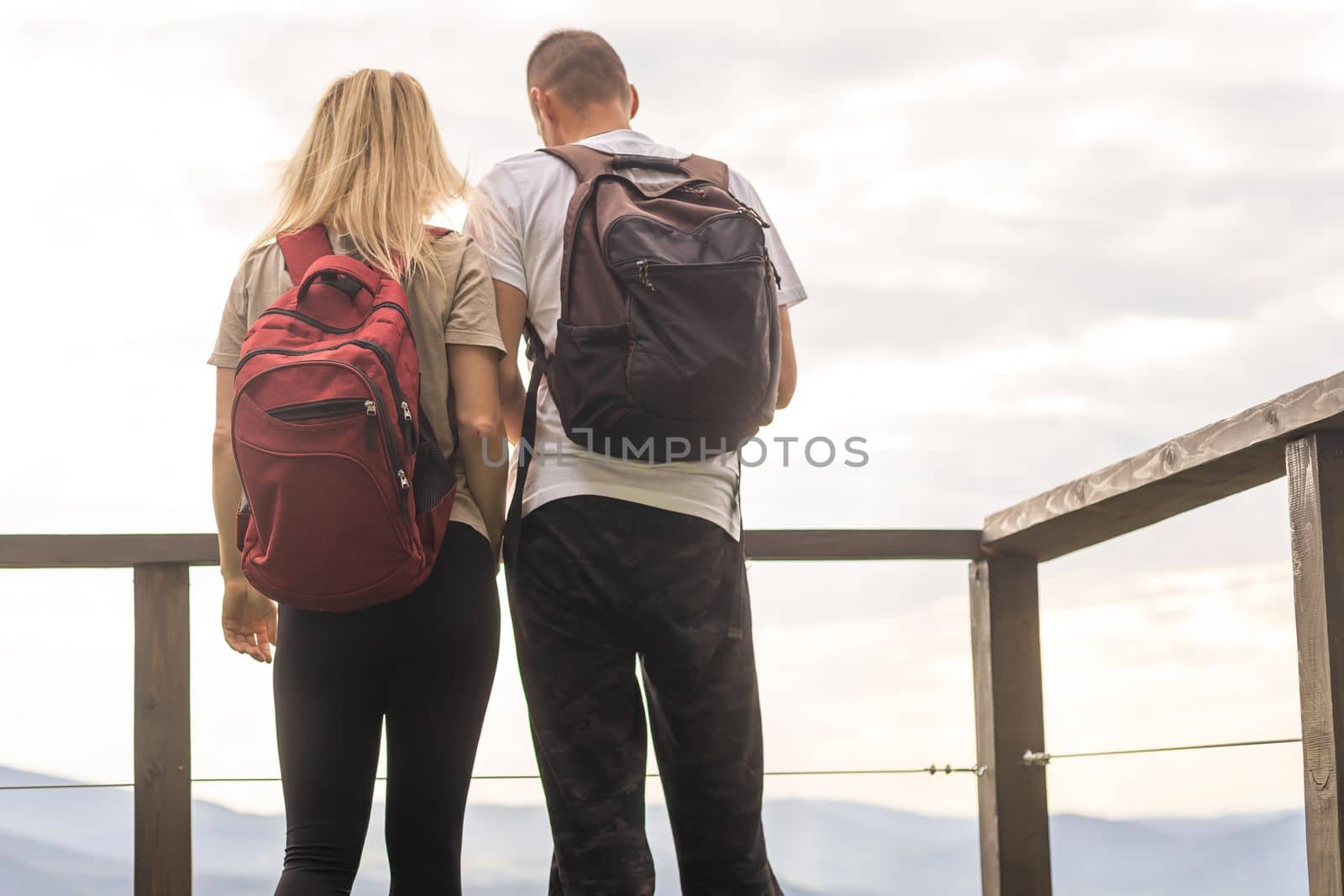 Couple on the balcony against the backdrop of mountains. life terrace pretty happiness summer home. by Andelov13