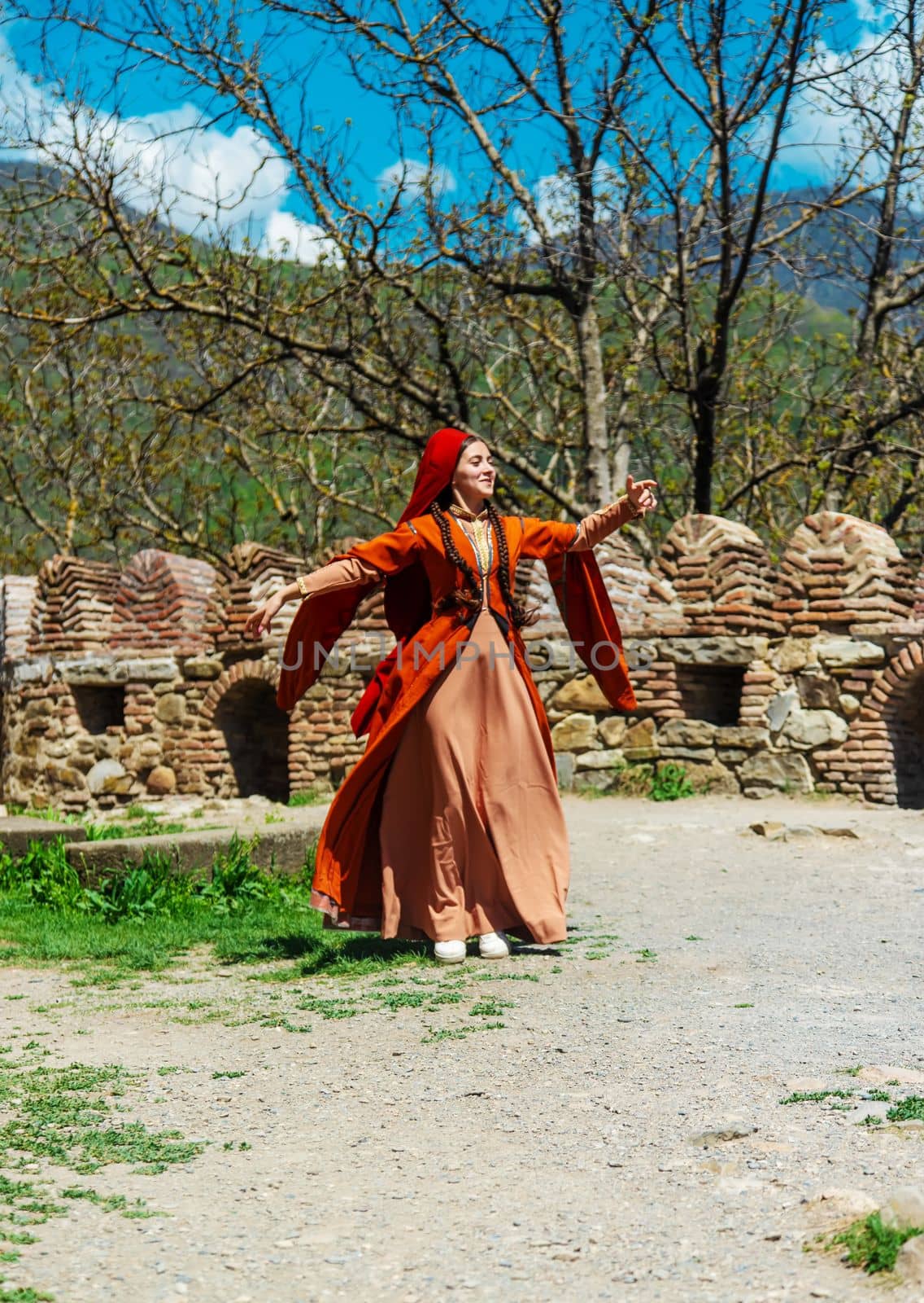 Georgian girl in national costume dances Georgian national dances. selective focus.people