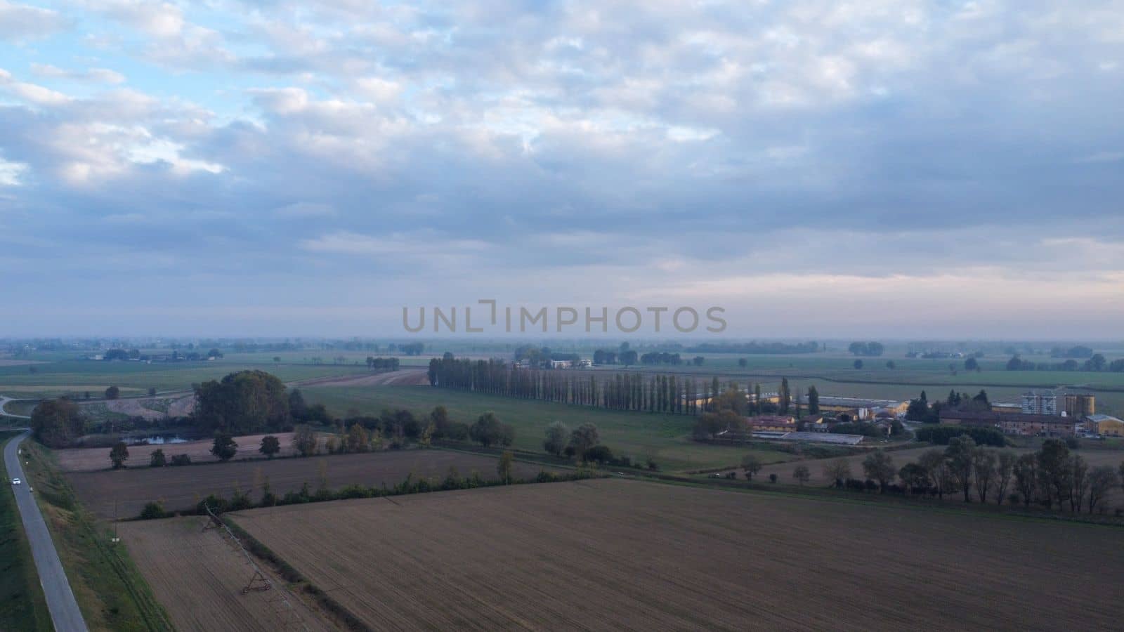 Stagno Lombardo, Italy - November 2022 drone view of rural area near river Po at dusk