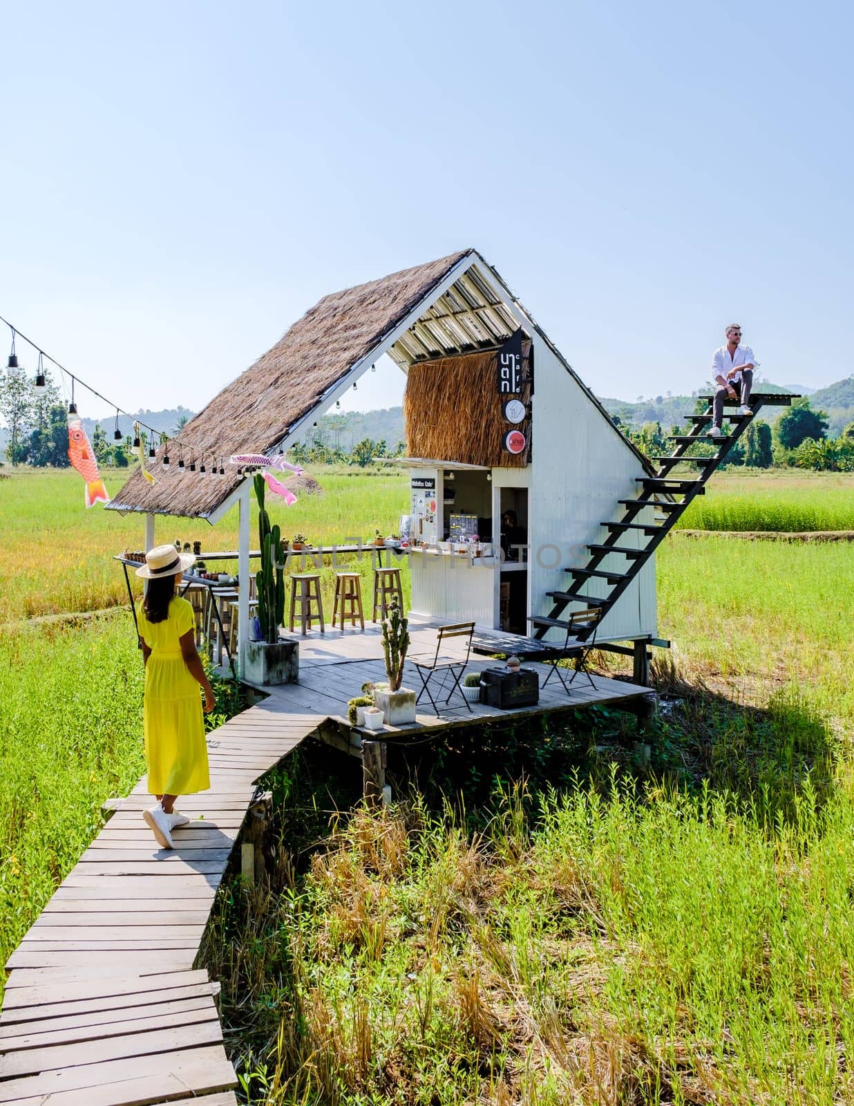 Nan Thailand December 2021, people visiting a coffee shop in the rice fields with white stairs a popular cafe at a homestay in Nan Thailand, Nathatha cafe