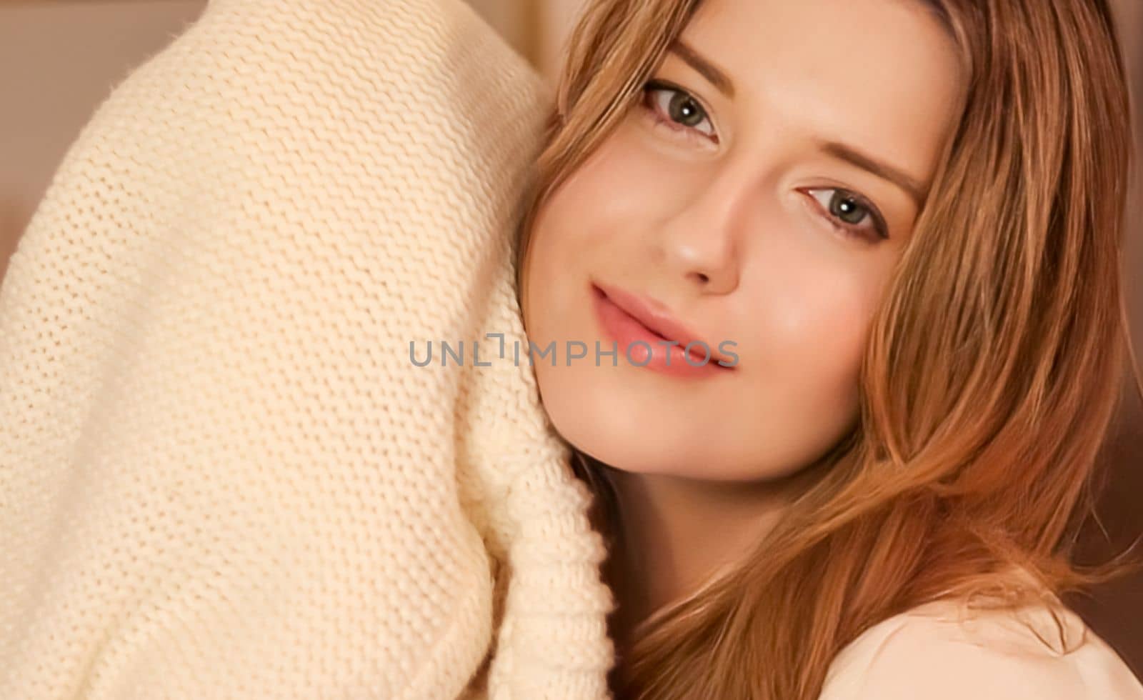 Woman enjoying warm and soft knitted clothing fabric material at home, laundry and comfort by Anneleven