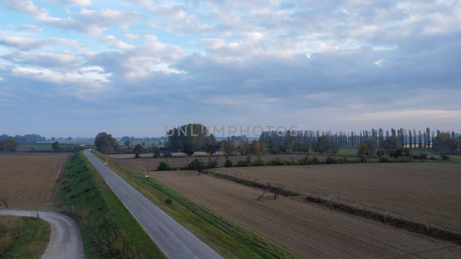 Stagno Lombardo, Italy - November 2022 drone view of rural area near river Po at dusk