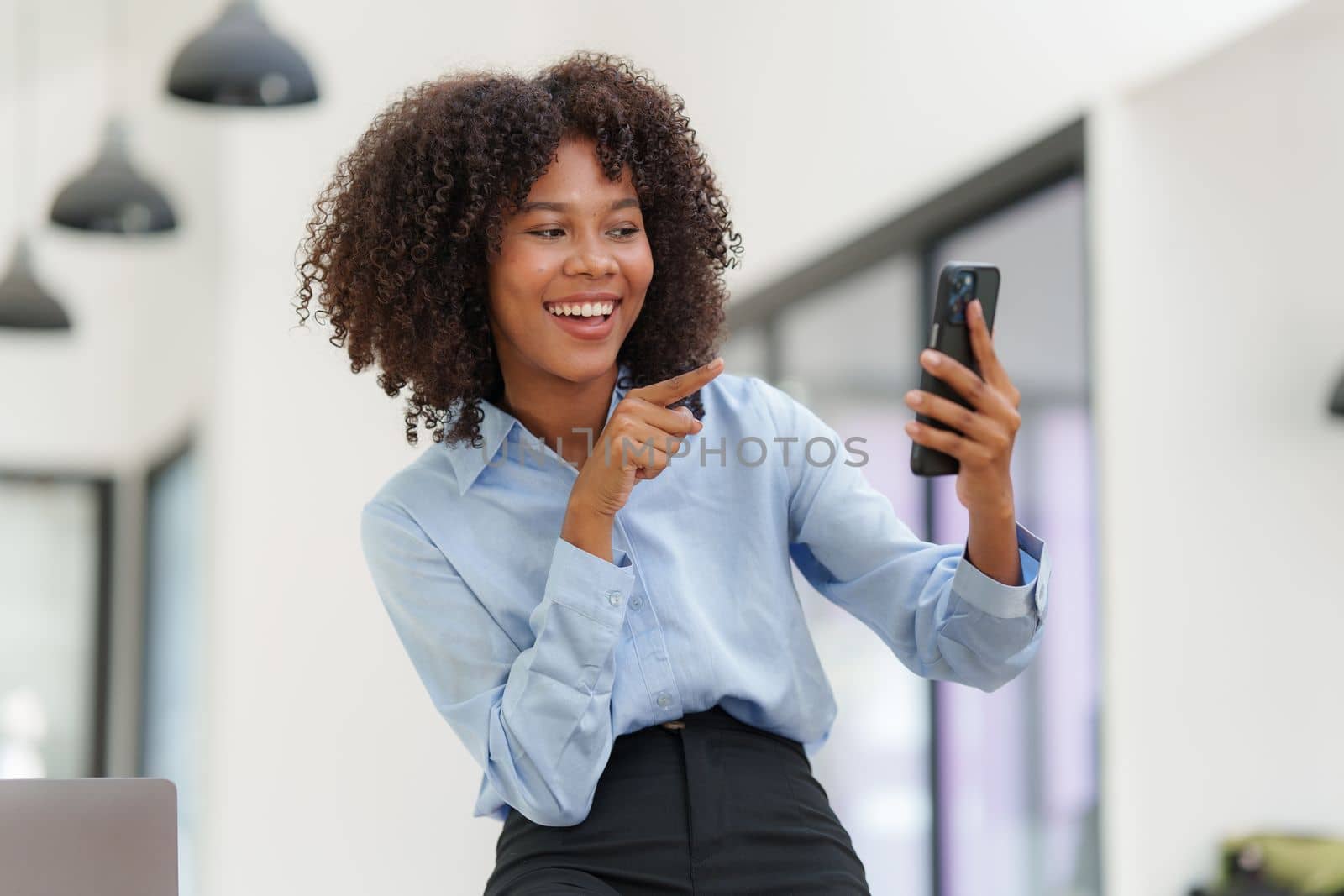 Business black woman having phone conversation with client in office. Woman reading news, report or email. Online problem, finance mistake, troubleshooting by itchaznong