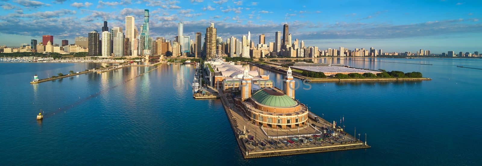 Stunning panorama of entire Navy Pier on Lake Michigan in Chicago with skyline during morning light by njproductions