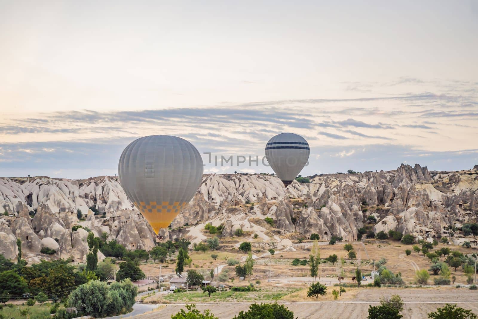 Colorful hot air balloon flying over Cappadocia, Turkey by galitskaya